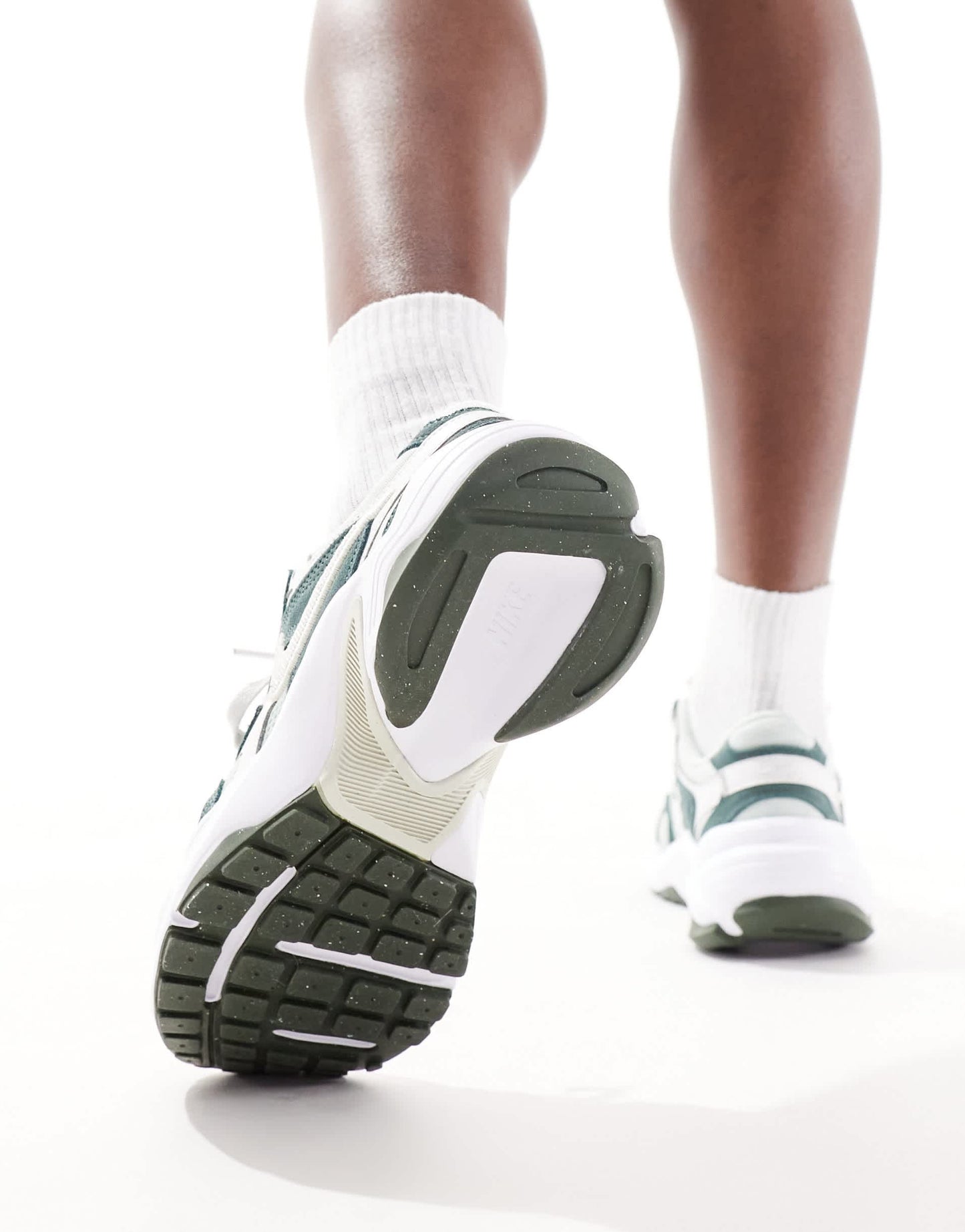 Nike AL8 trainers in green and white