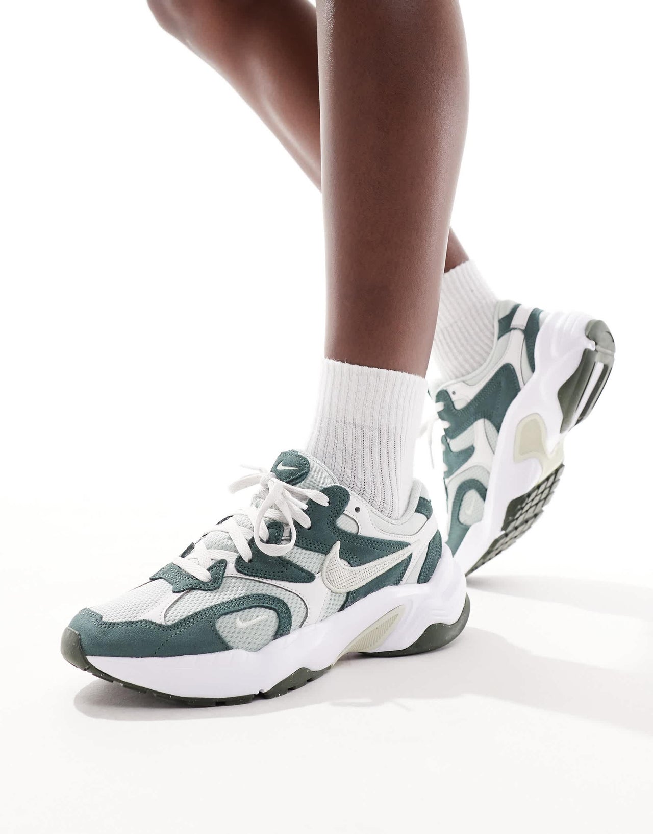 Nike AL8 trainers in green and white