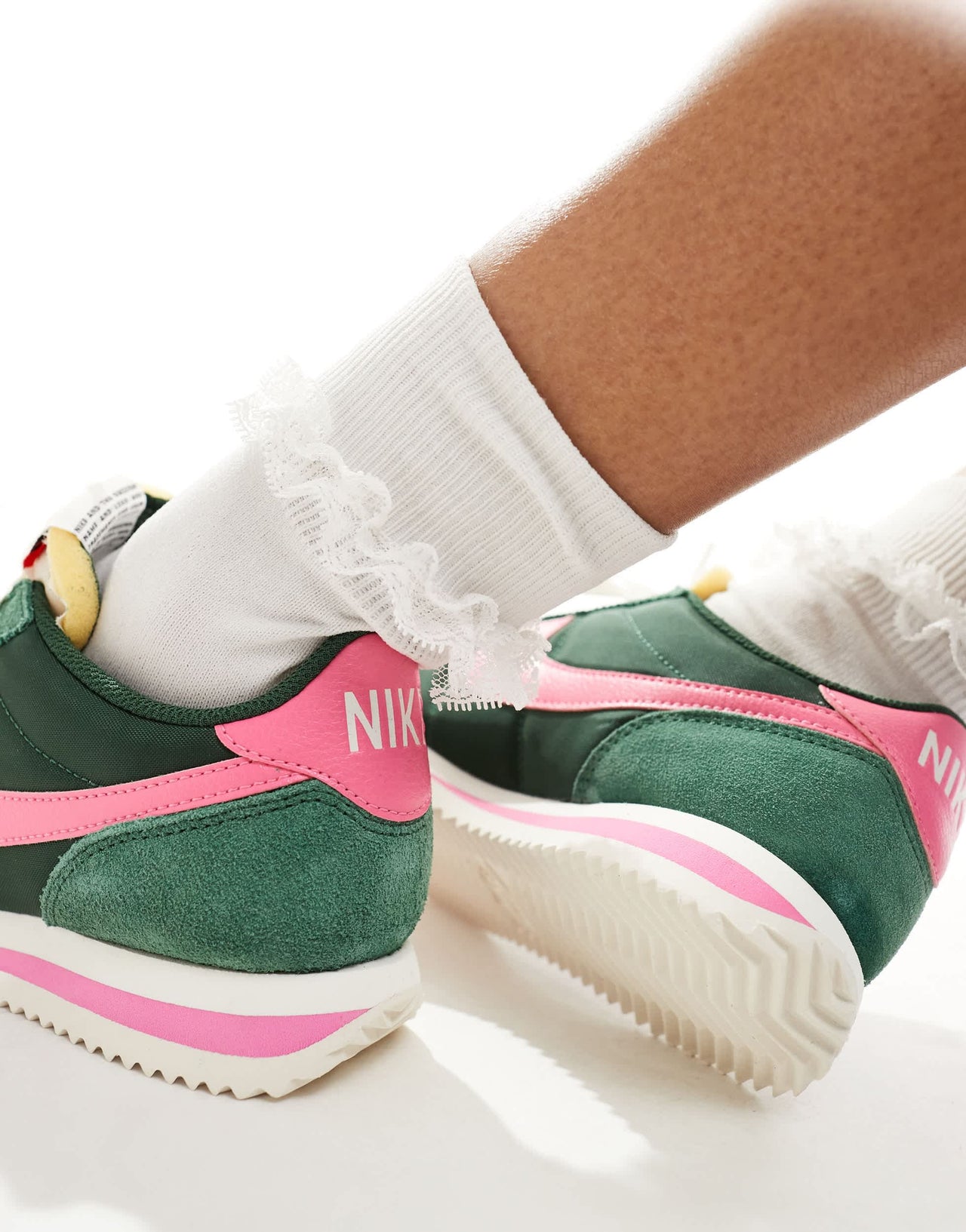 Nike Cortez TXT unisex trainers in dark green and pink