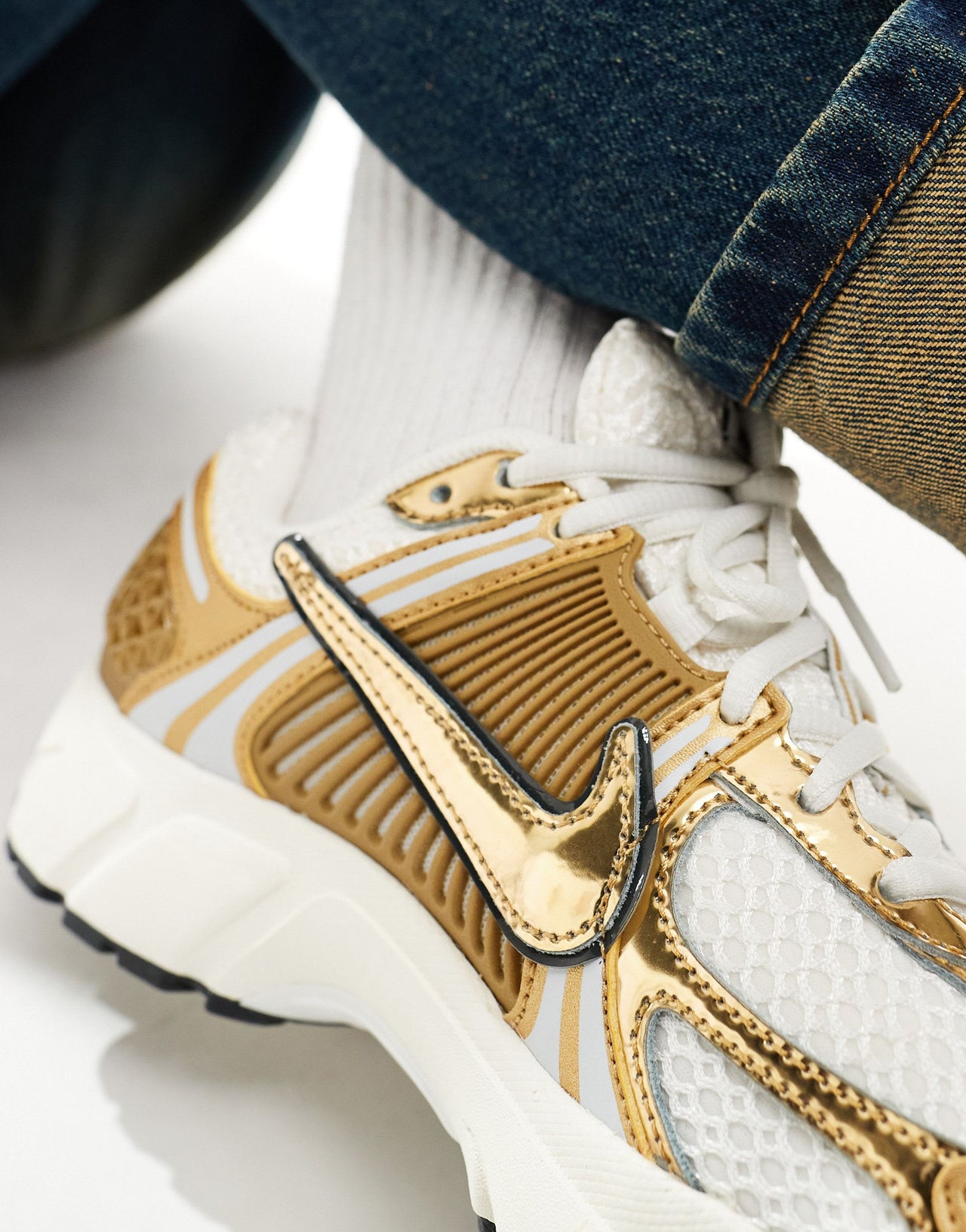 Nike Zoom Vomero 5 trainers in white and gold