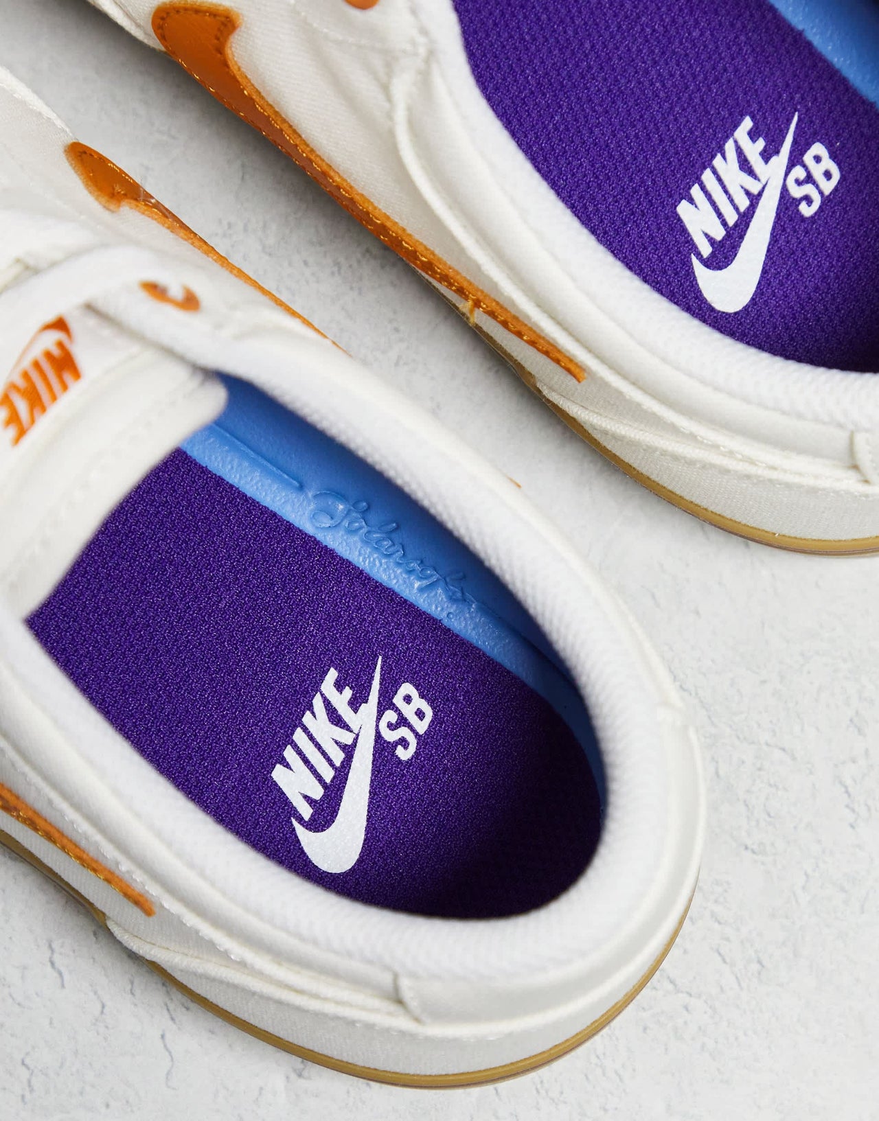 Nike SB Chron 2 canvas trainers in white and orange