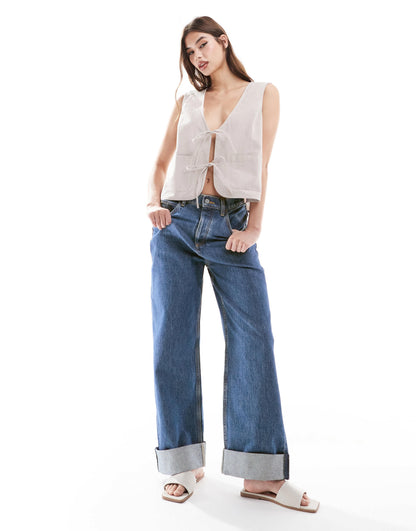 ASOS DESIGN loose jeans with deep turn up cuff in dark vintage blue