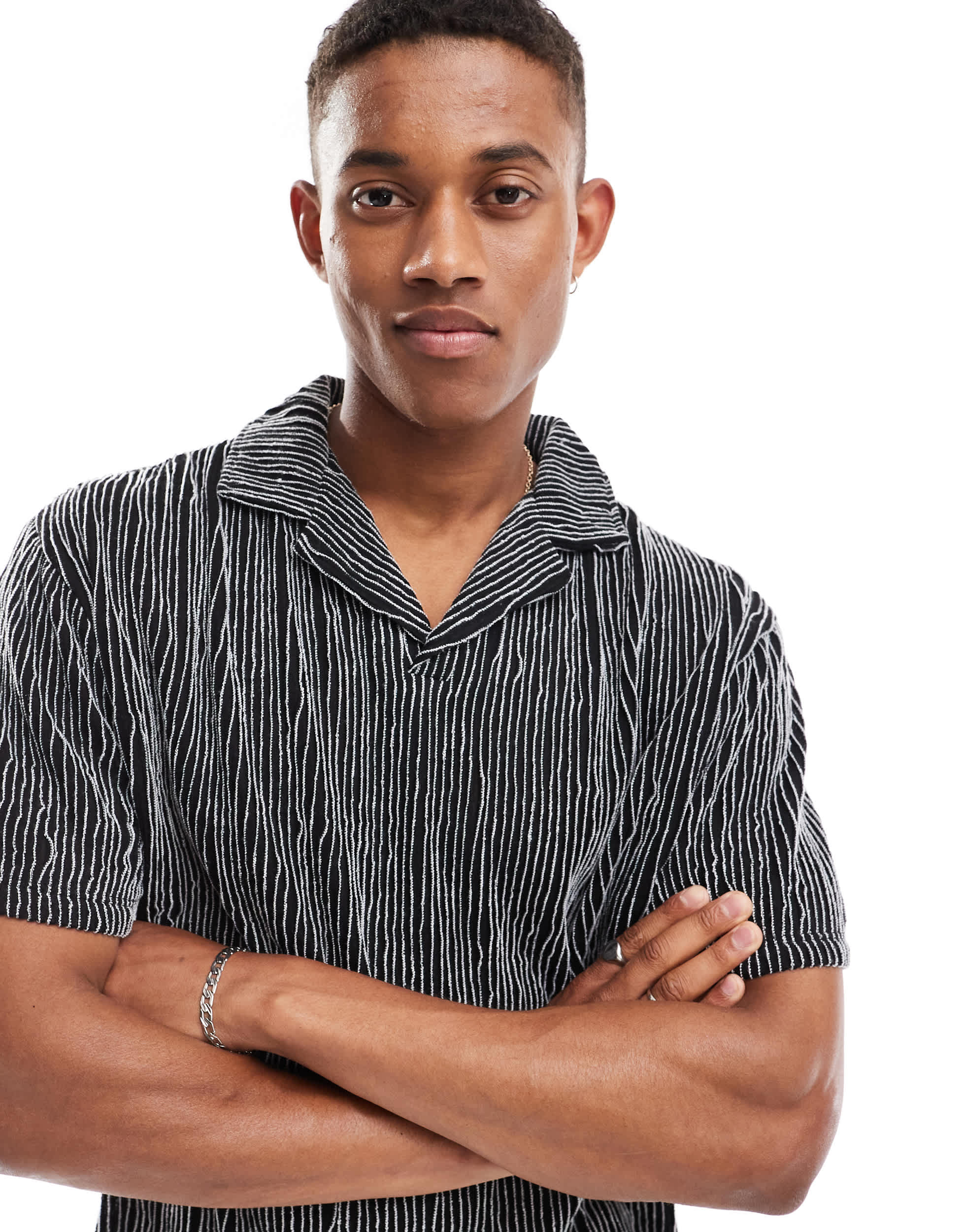 ASOS DESIGN relaxed revere polo in black textured stripe