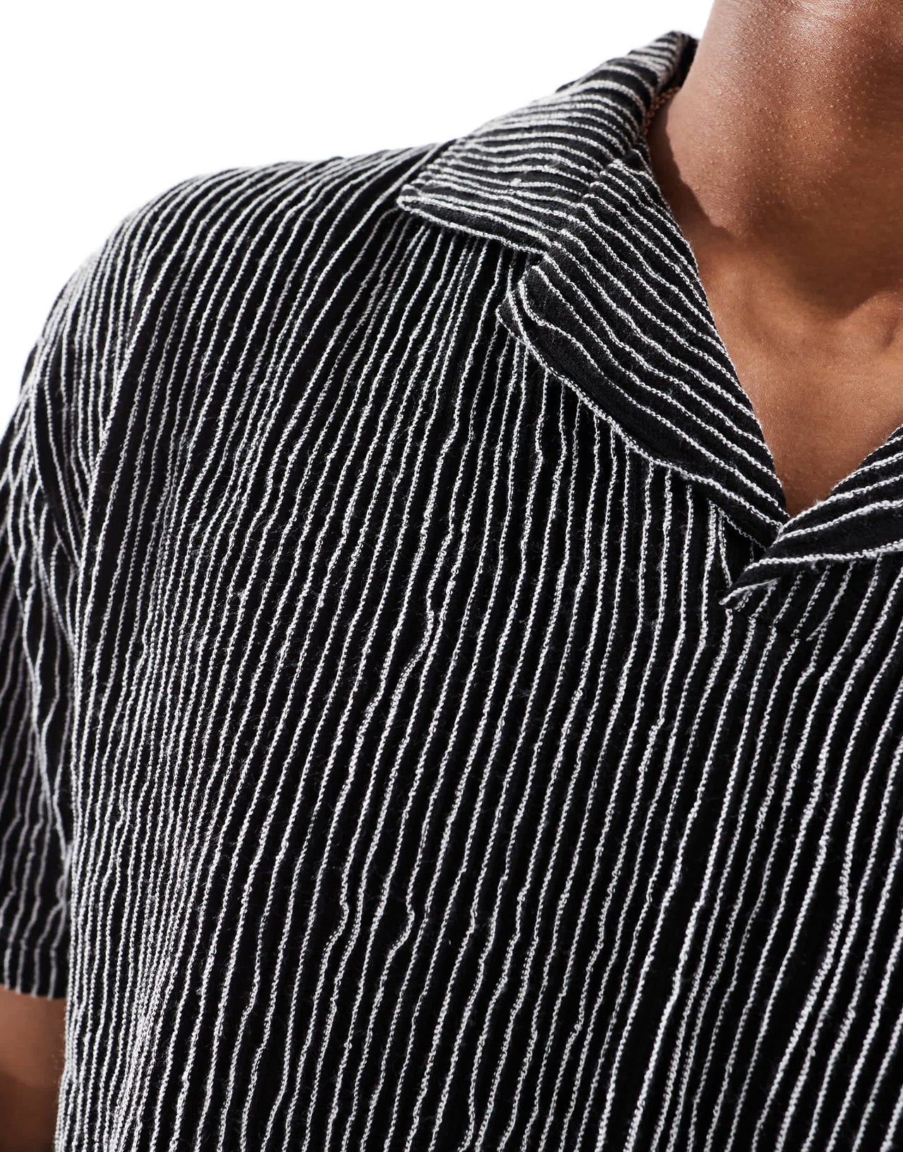 ASOS DESIGN relaxed revere polo in black textured stripe