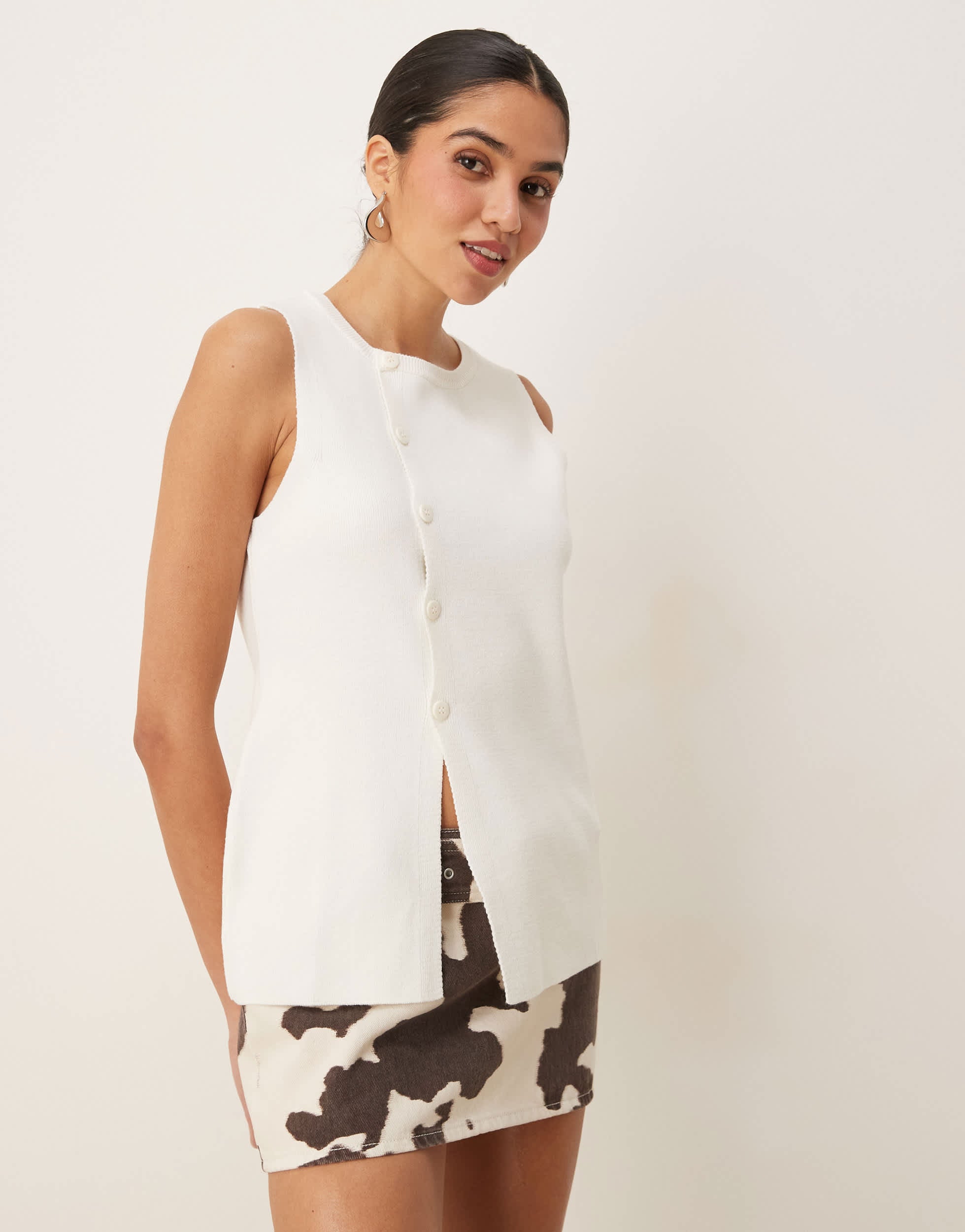 ASOS DESIGN knitted structured asymmetric button front waistcoat with split in cream