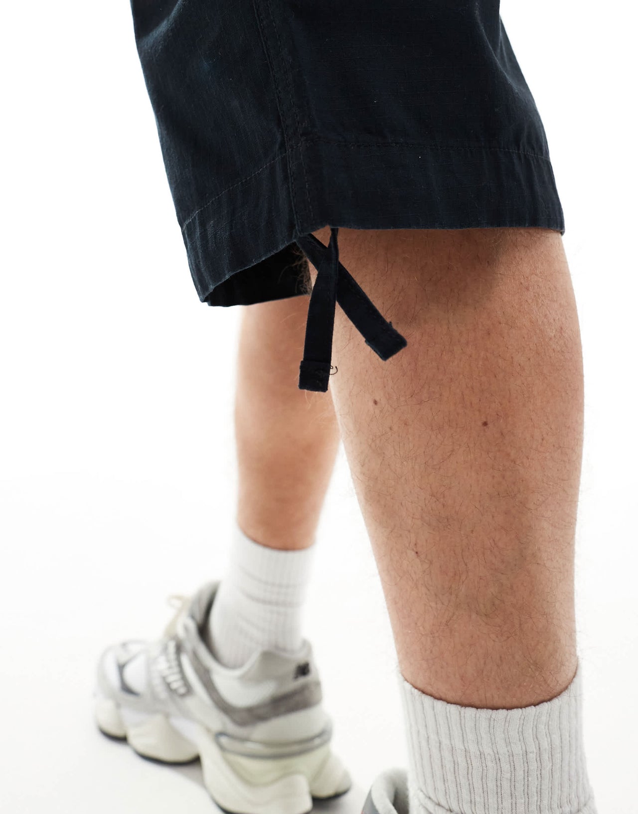 ASOS DESIGN longer length parachute cargo shorts in black