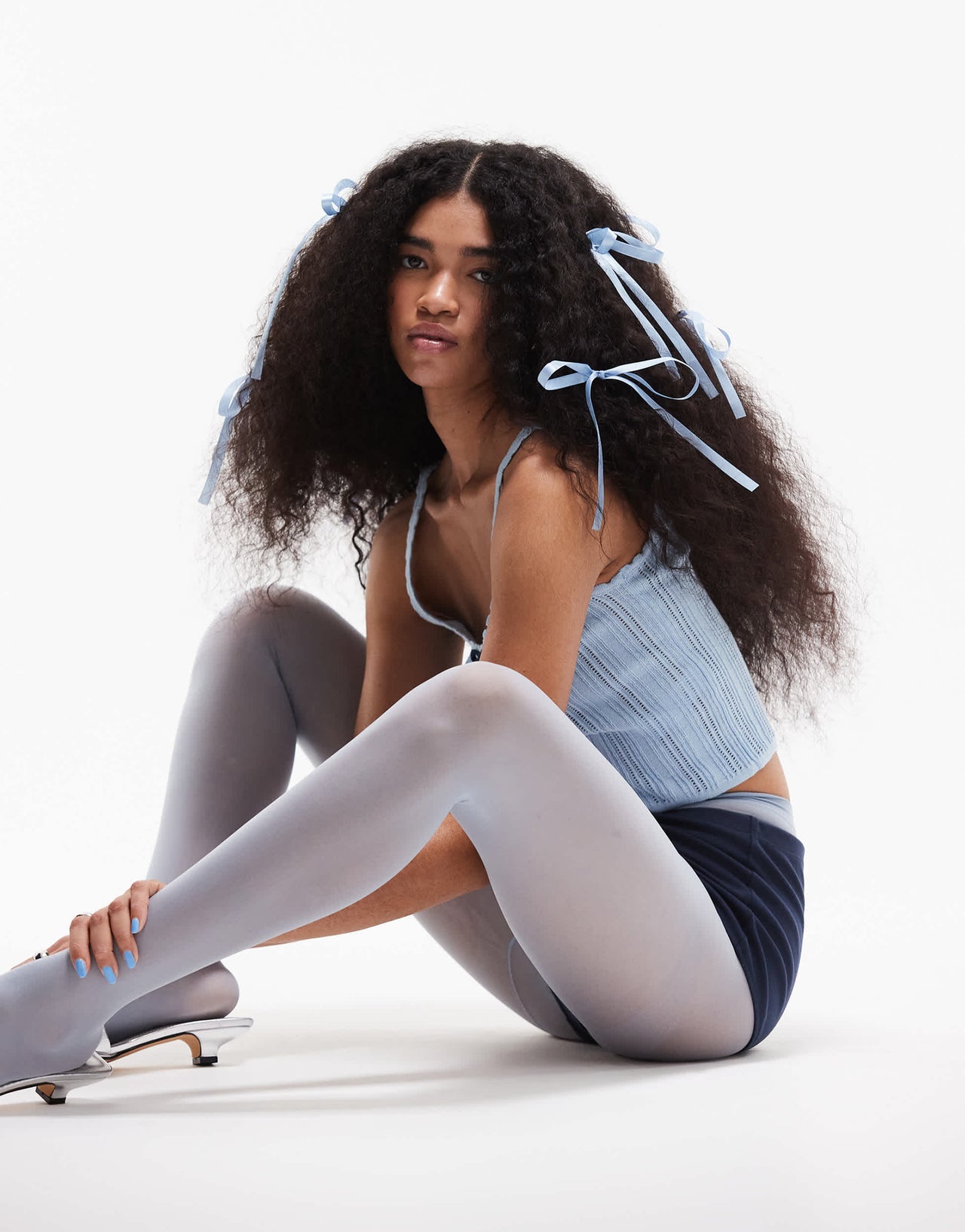 ASOS DESIGN knitted cami top in pointelle stitch with contrast bow detail in blue