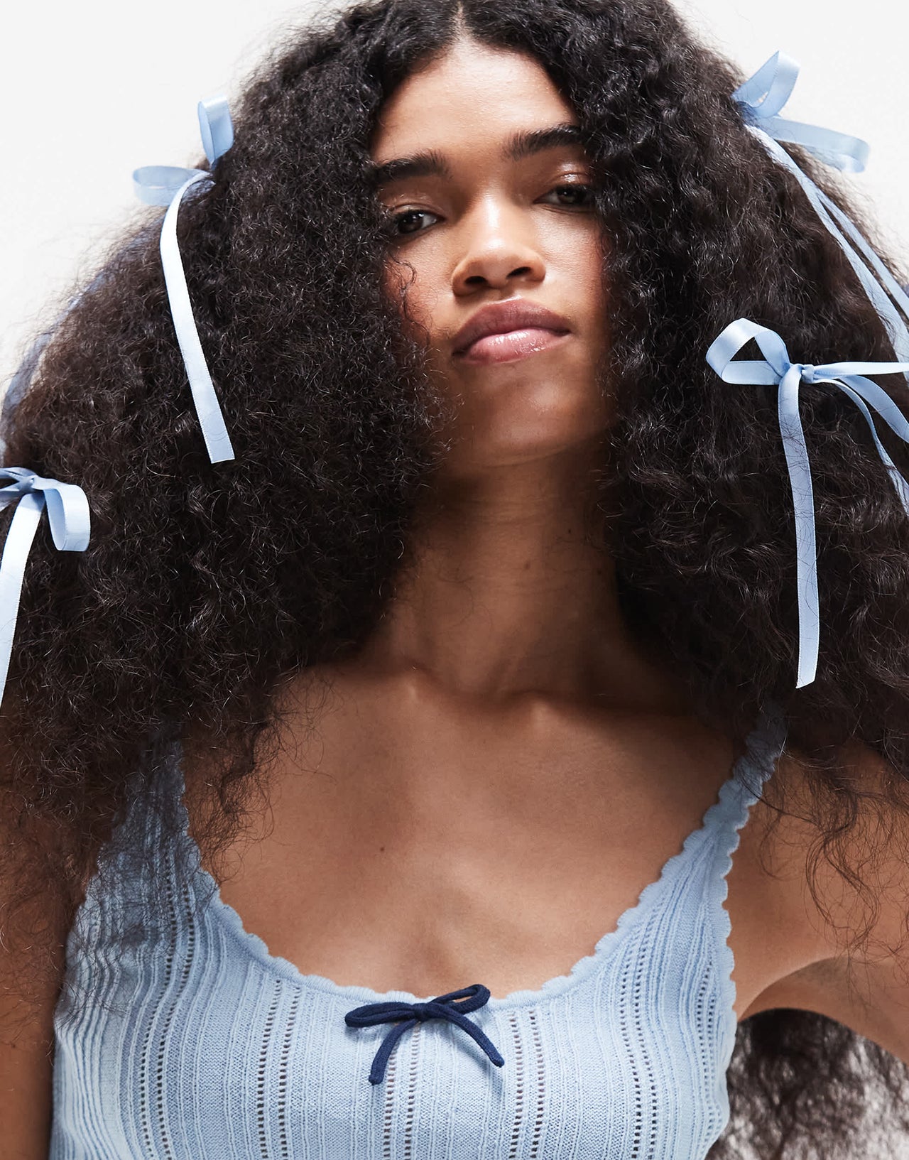 ASOS DESIGN knitted cami top in pointelle stitch with contrast bow detail in blue