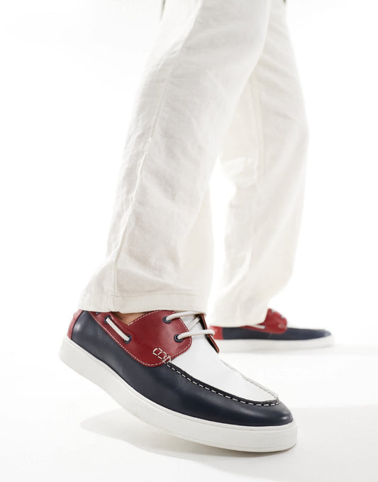 ASOS DESIGN lace up boat shoes in navy suede with red and white details