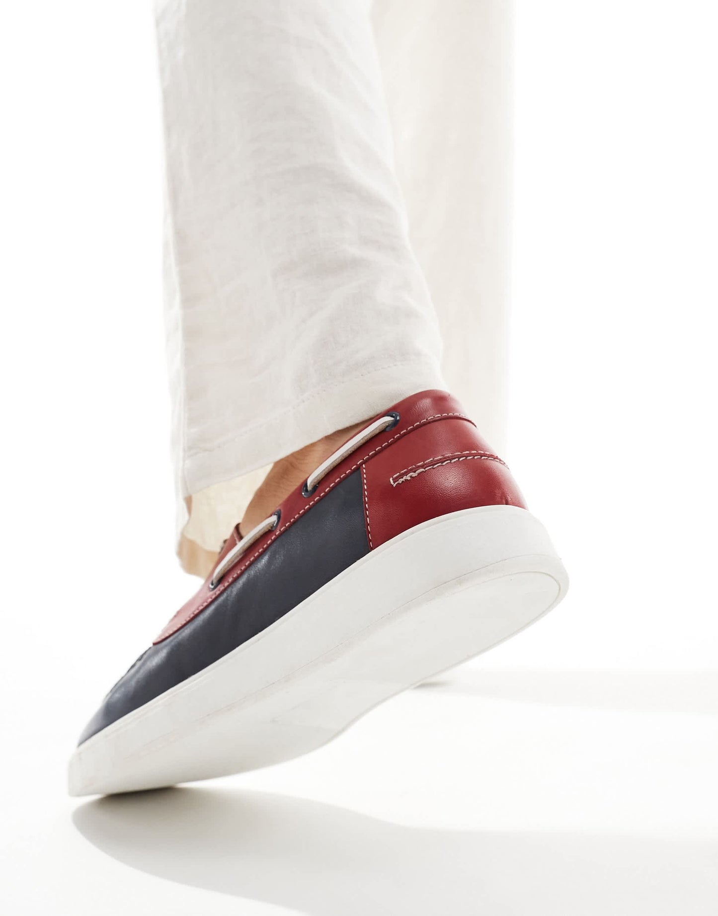 ASOS DESIGN lace up boat shoes in navy suede with red and white details
