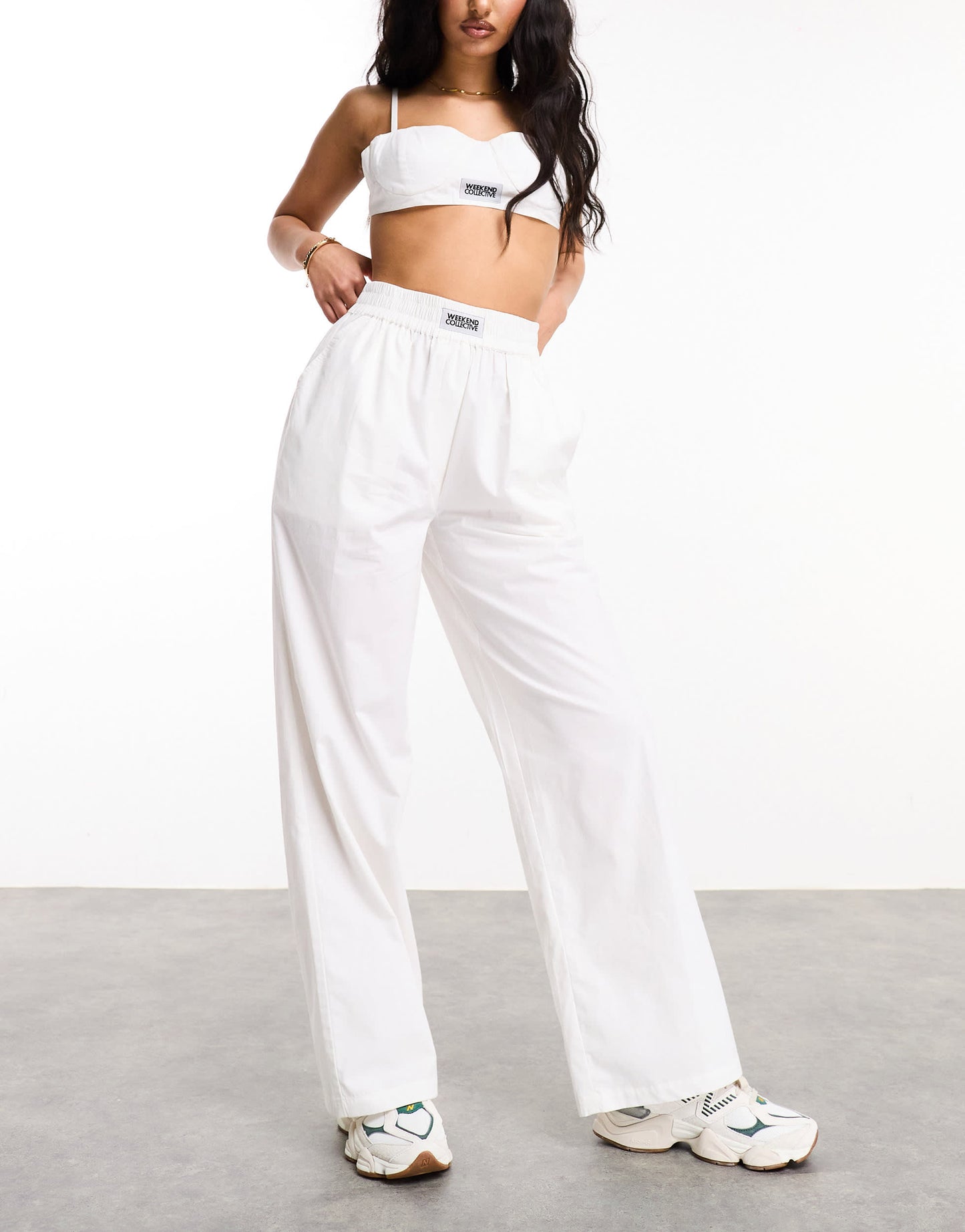 Weekend Collective woven trousers with label in white