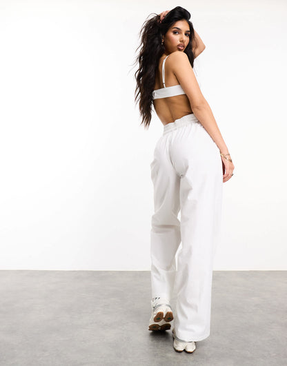 Weekend Collective woven trousers with label in white