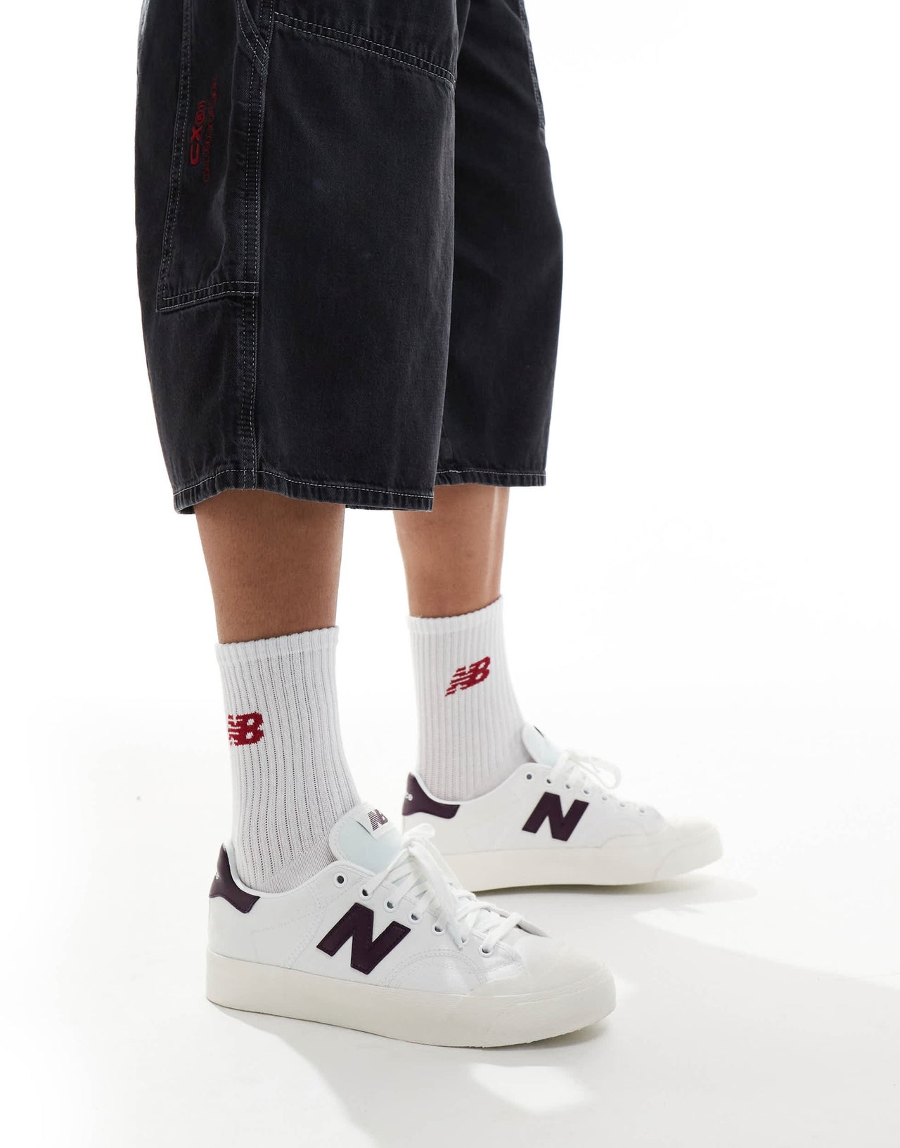 New Balance 100 trainers in white and burgundy