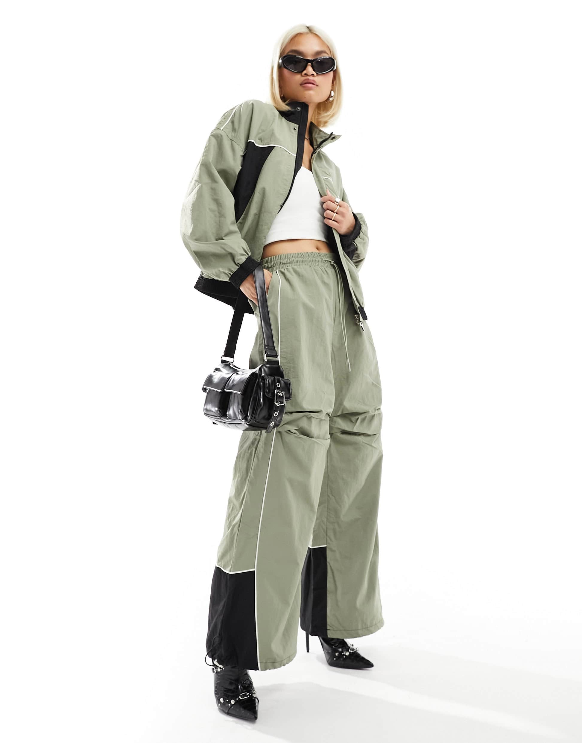 The Kript wide leg tech trousers with contrast detail co-ord in sage and black