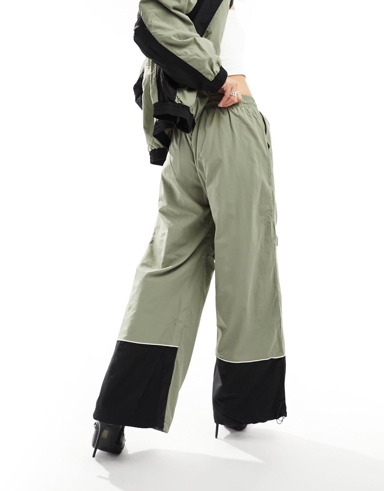 The Kript wide leg tech trousers with contrast detail co-ord in sage and black