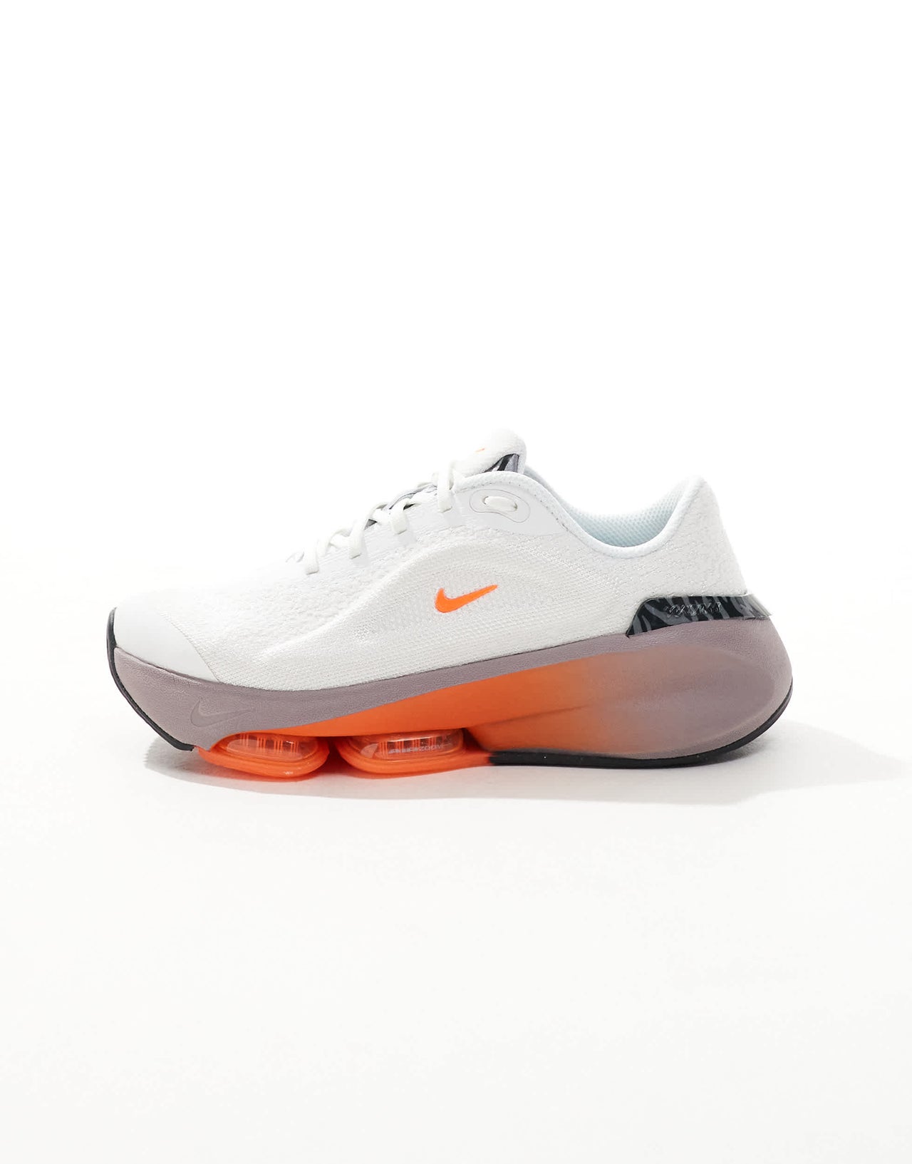 Nike Training Versair trainers in white and orange