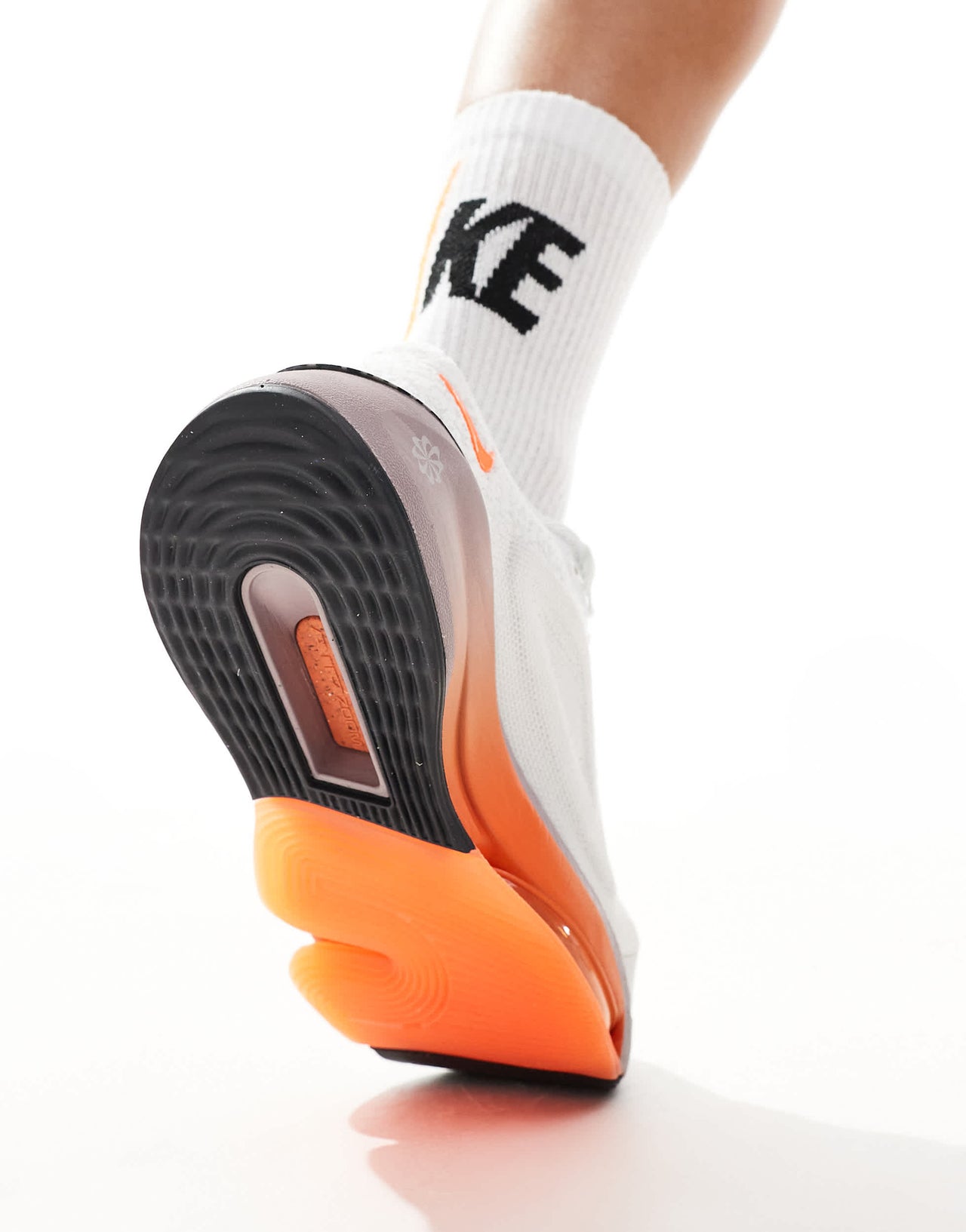 Nike Training Versair trainers in white and orange