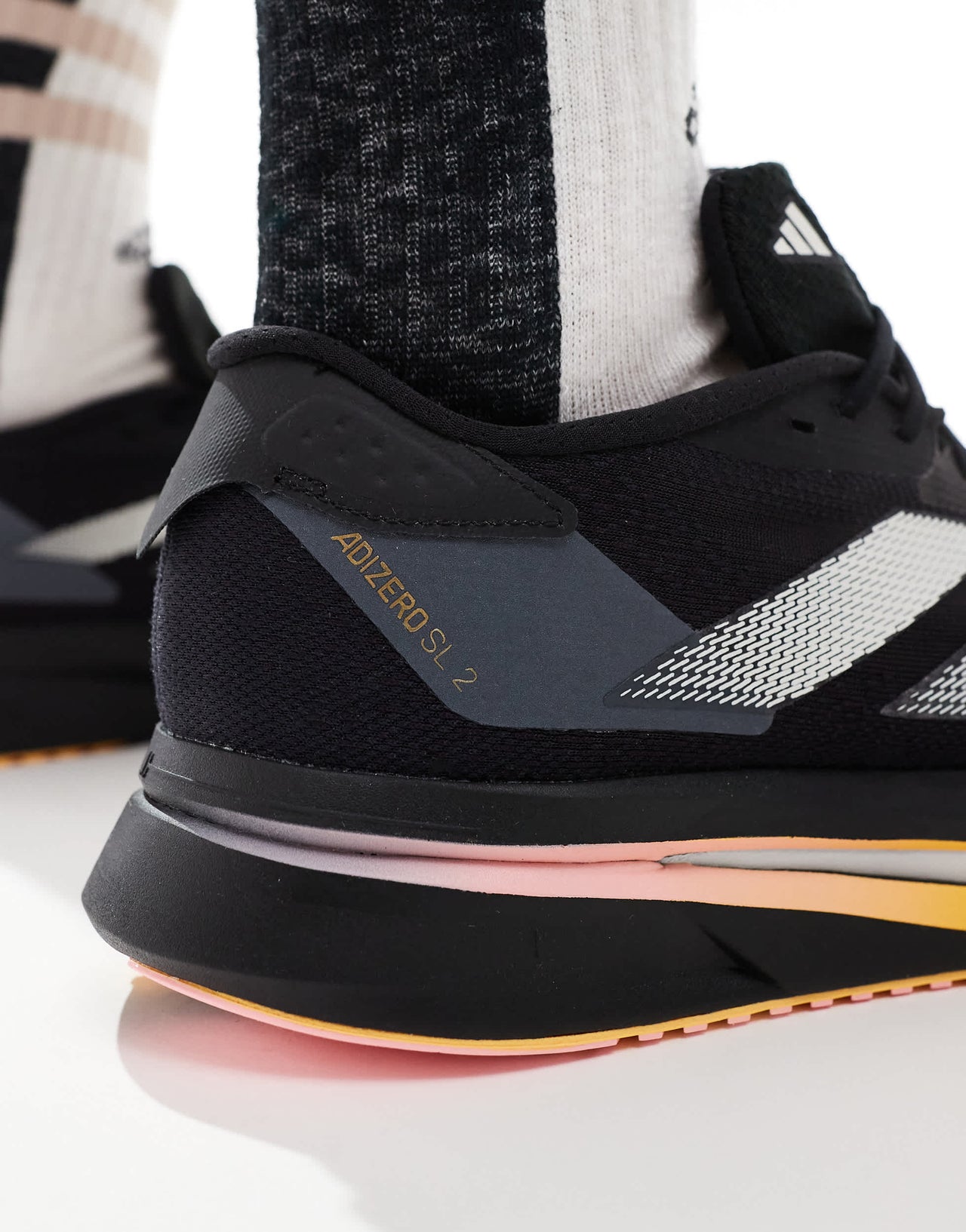 adidas Running Adizero SL2 trainers in black with orange
