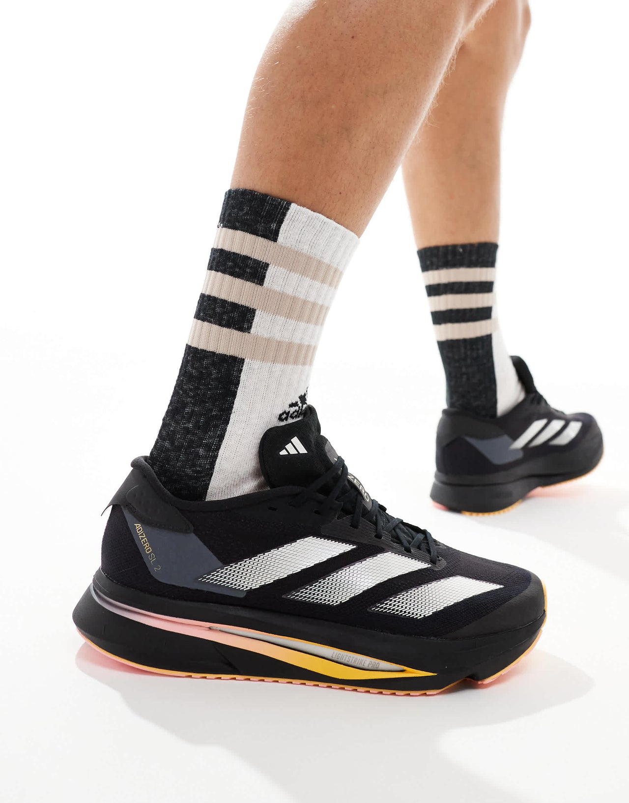 adidas Running Adizero SL2 trainers in black with orange