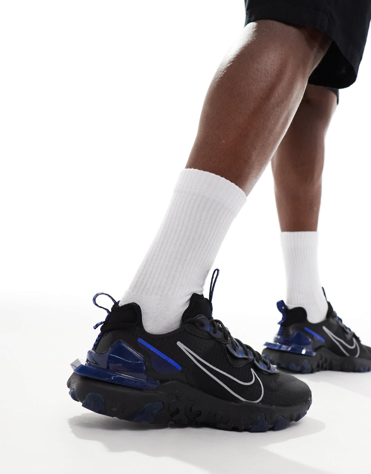 Nike React Vision trainers in black and blue