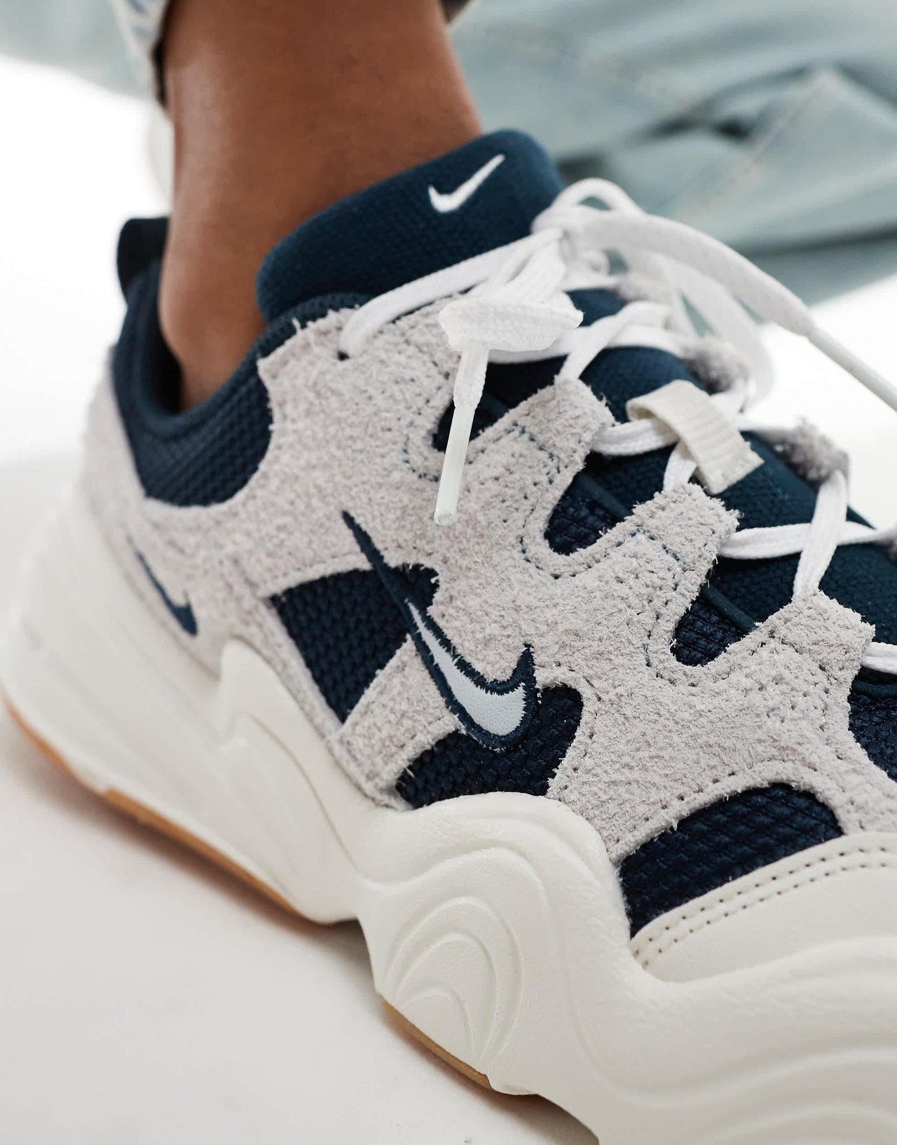 Nike Tech Hera trainers in off white with navy detail