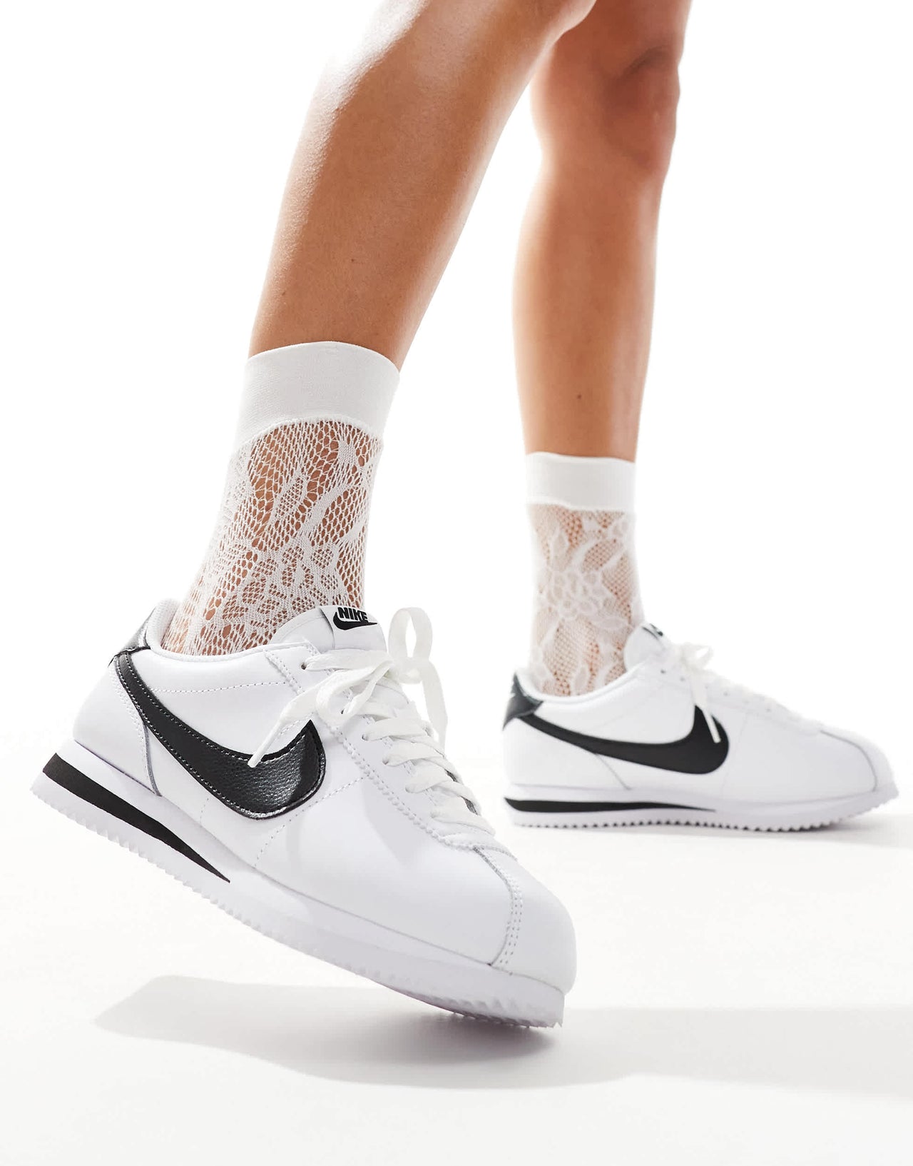 Nike Cortez trainers in white and black