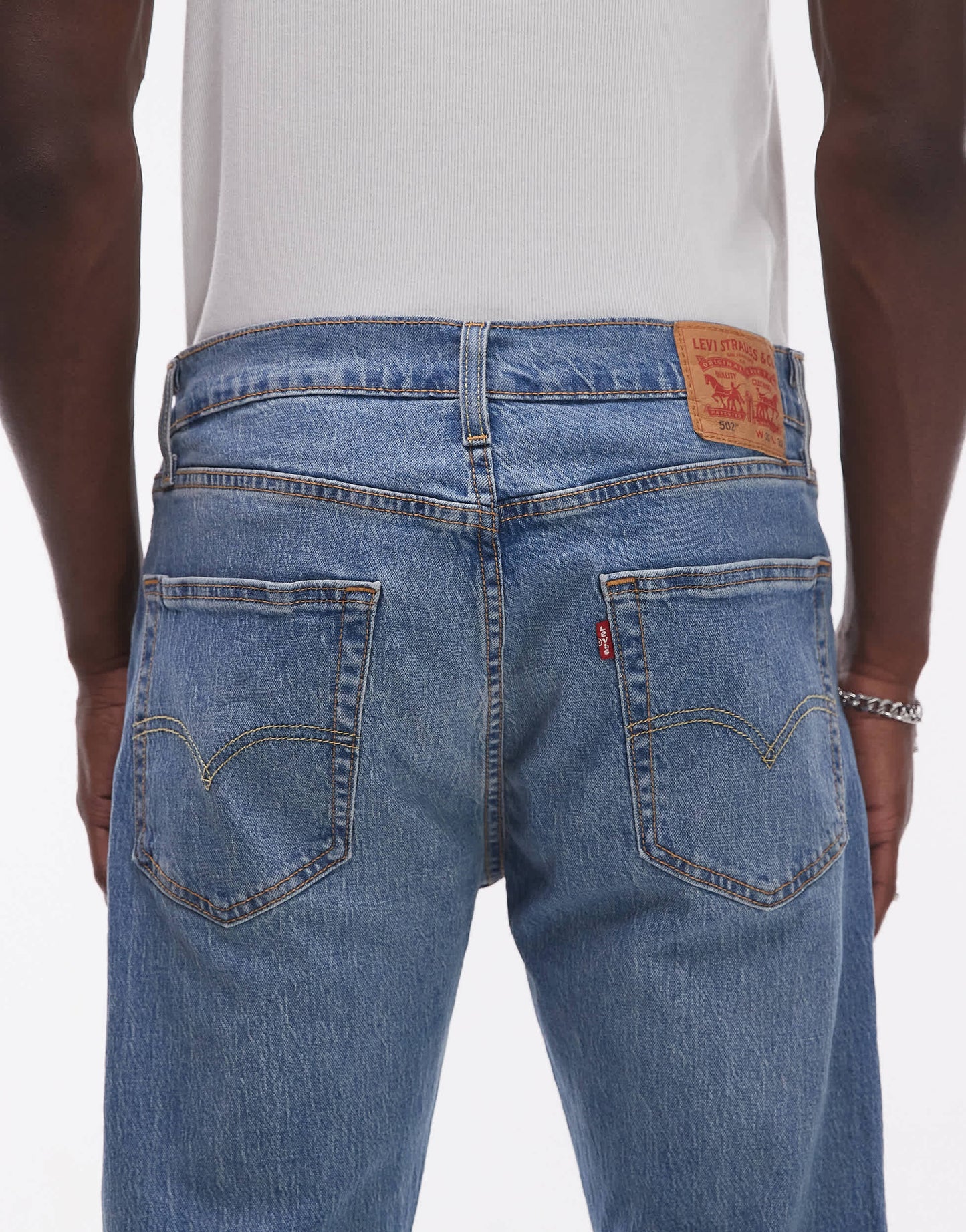 Levi's 502 tapered fit performance cool denim jeans in mid blue