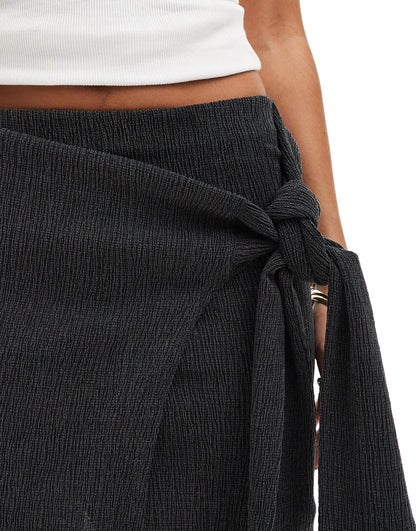 ASOS DESIGN textured mini skirt with tie detail in black