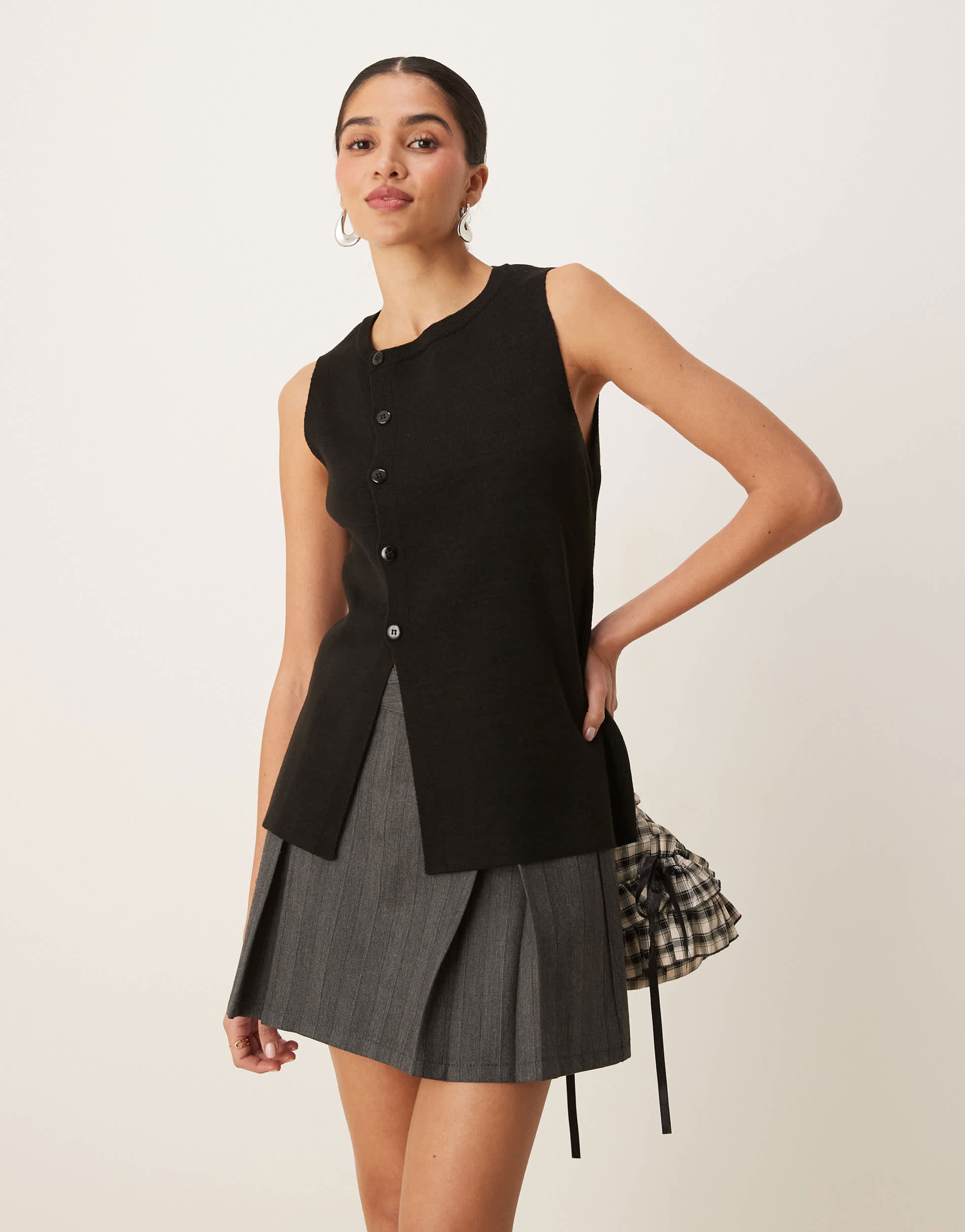 ASOS DESIGN knitted structured asymmetric button front waistcoat with split in black