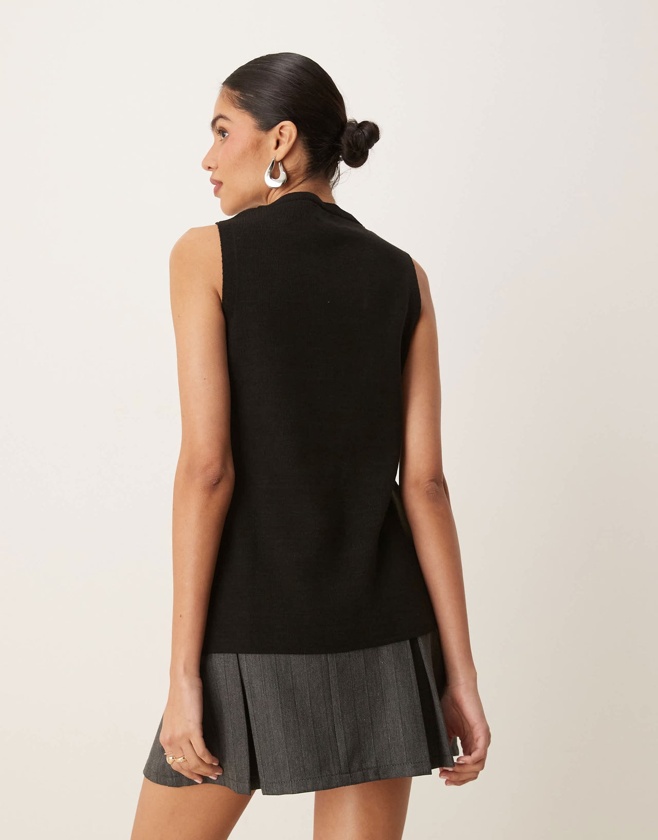 ASOS DESIGN knitted structured asymmetric button front waistcoat with split in black