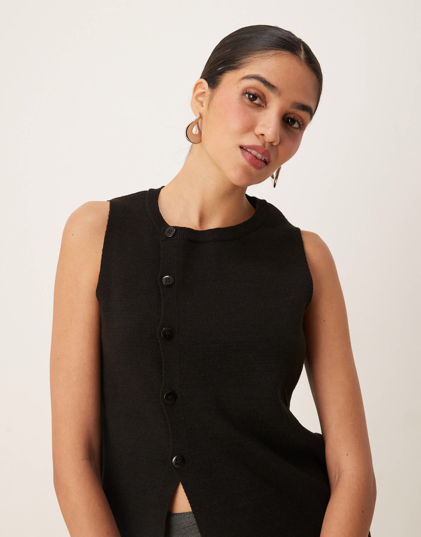 ASOS DESIGN knitted structured asymmetric button front waistcoat with split in black