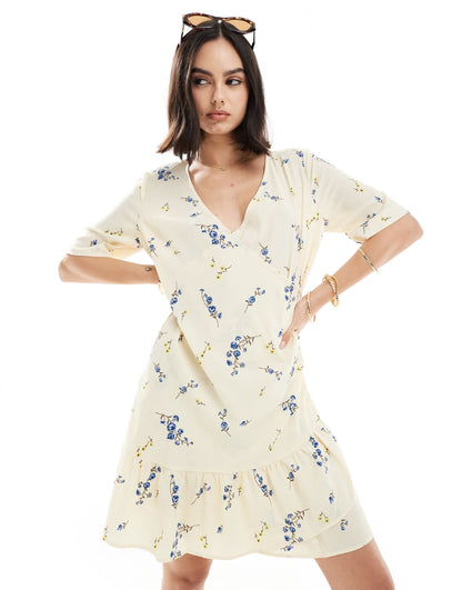 Vero Moda wrap front mini dress in light yellow floral