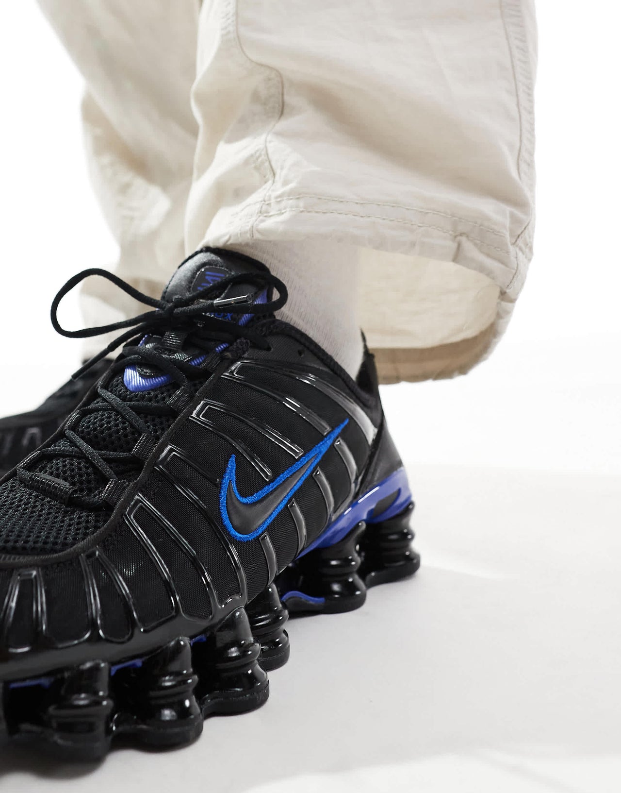 Nike Shox TL trainers in black and racer blue