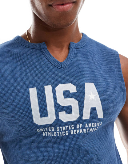 ASOS DESIGN muscle fit tank vest in blue with cut neck and USA chest print