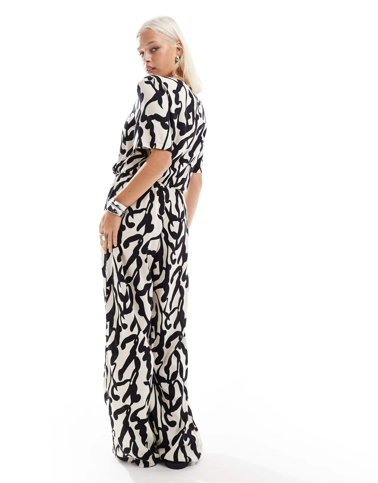 Monki short sleeve jumpsuit with wrap front in bold mono abstract print