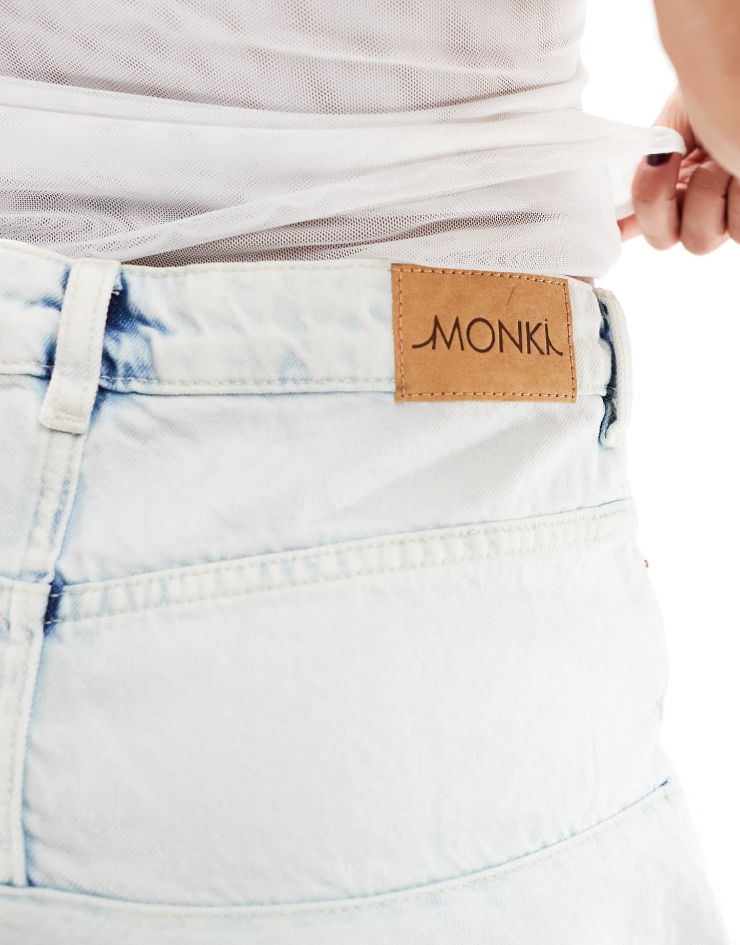 Monki mini denim asymmetric ruffle skirt in light blue
