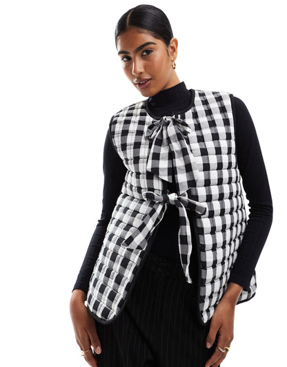 ASOS DESIGN quilted gilet with bows in mono gingham