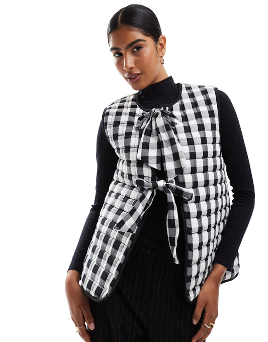 ASOS DESIGN quilted gilet with bows in mono gingham