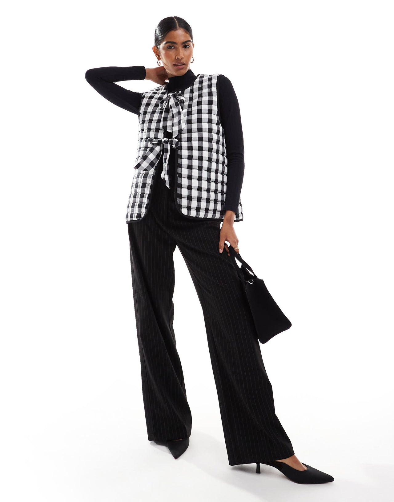 ASOS DESIGN quilted gilet with bows in mono gingham