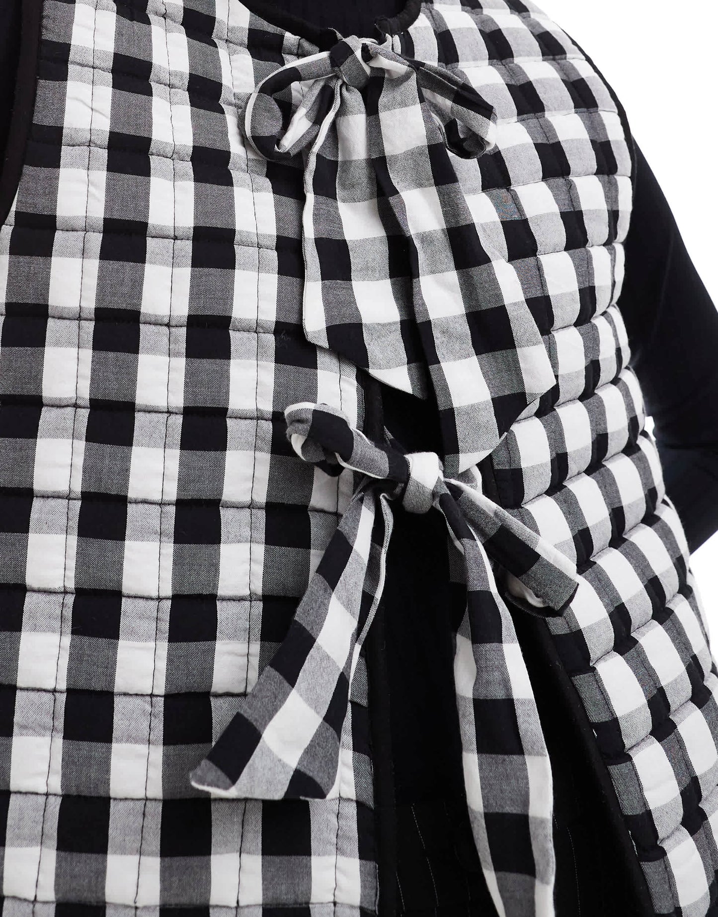 ASOS DESIGN quilted gilet with bows in mono gingham