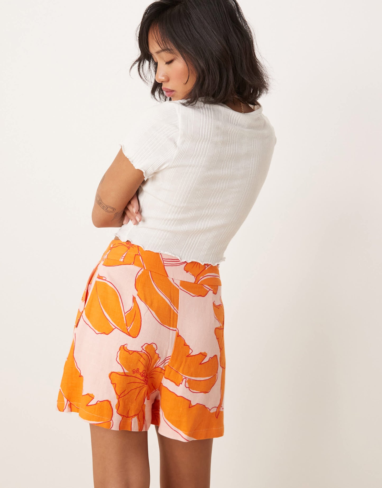 ASOS DESIGN Petite high waist seam detail tailored shorts with linen in palm print