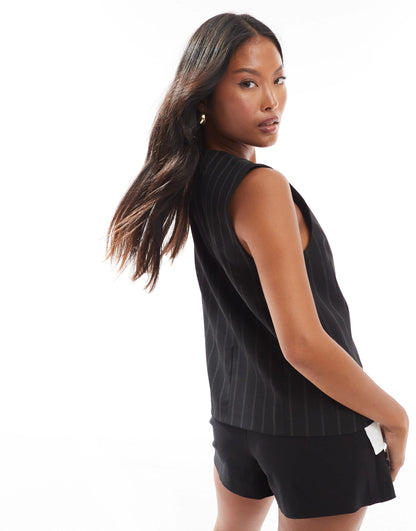 ASOS DESIGN Petite exposed pocket waistcoat in black stripe