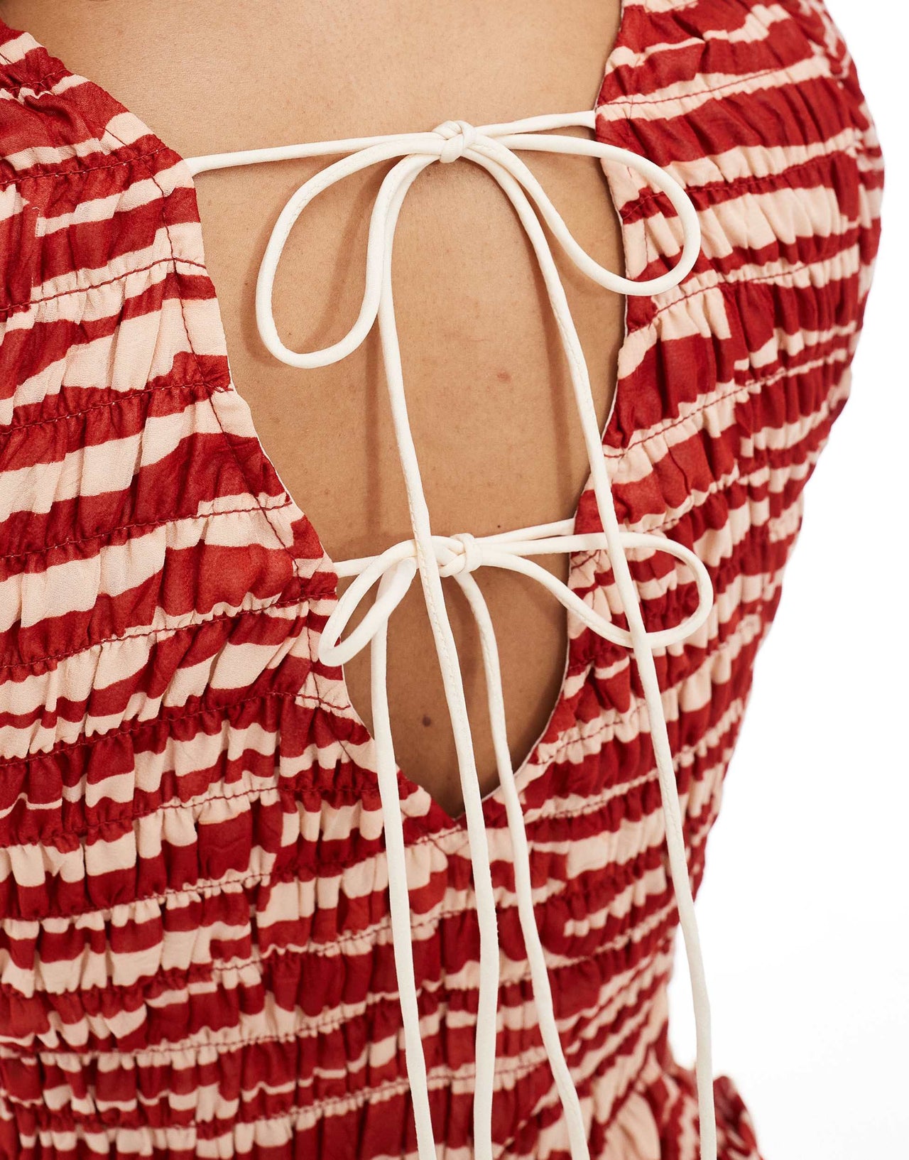 ASOS DESIGN shirred bodice tie up back mini dress in red abstract print