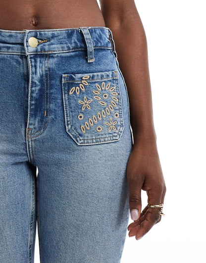River Island flare jean with embroidered pockets in midwash blue