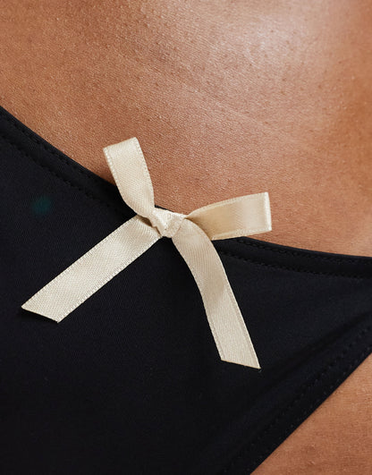 Miss Selfridge bow detail tie side bikini bottom in black