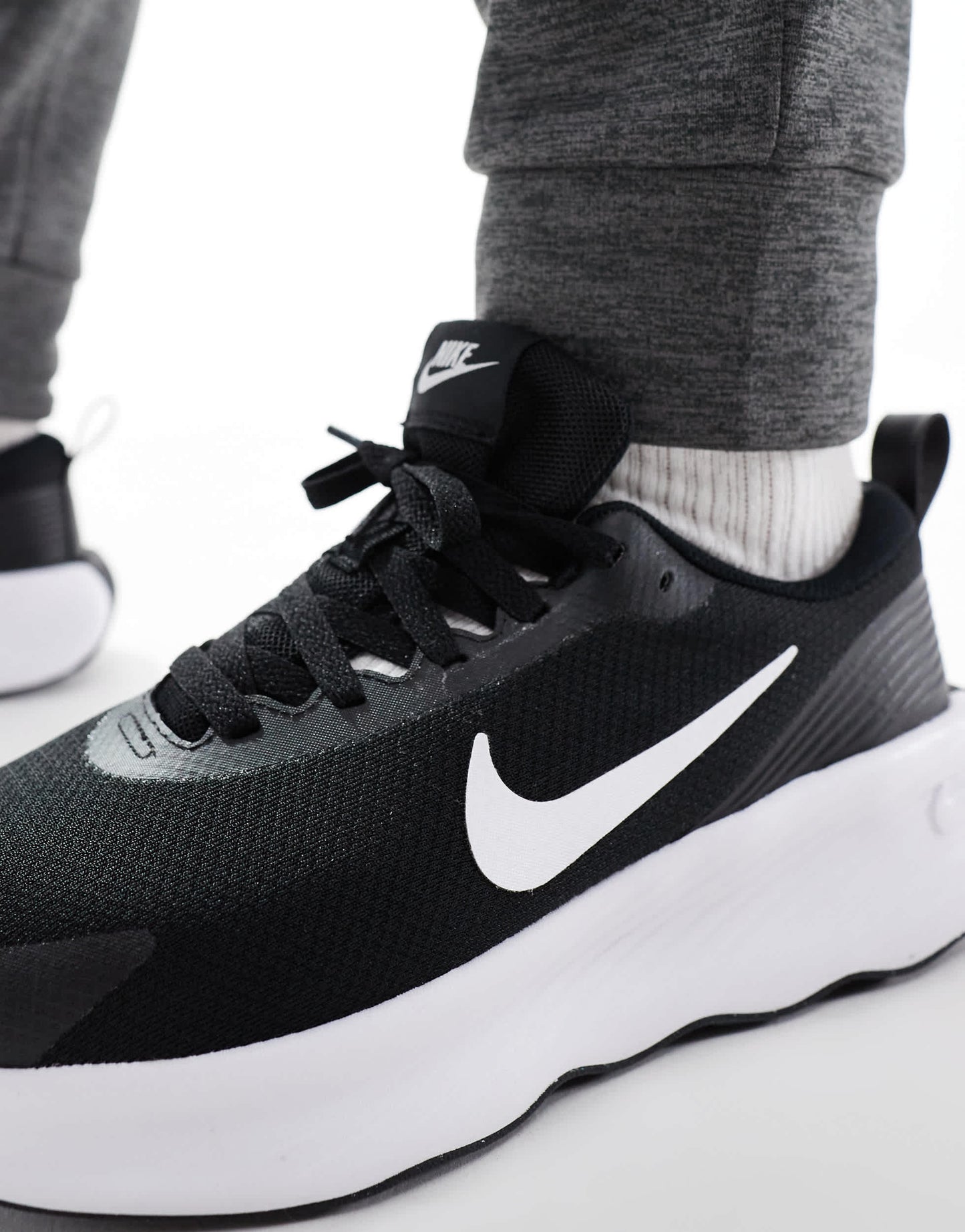 Nike Training Legend Essential 4 trainers in black and white