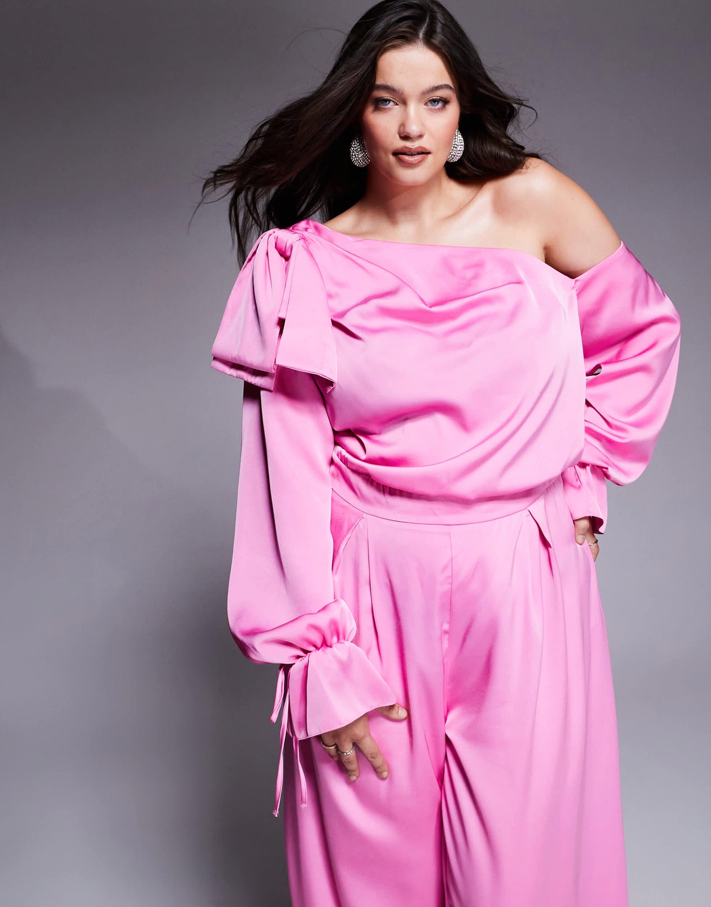 ASOS LUXE Curve satin off shoulder wide leg jumpsuit with bow in pink