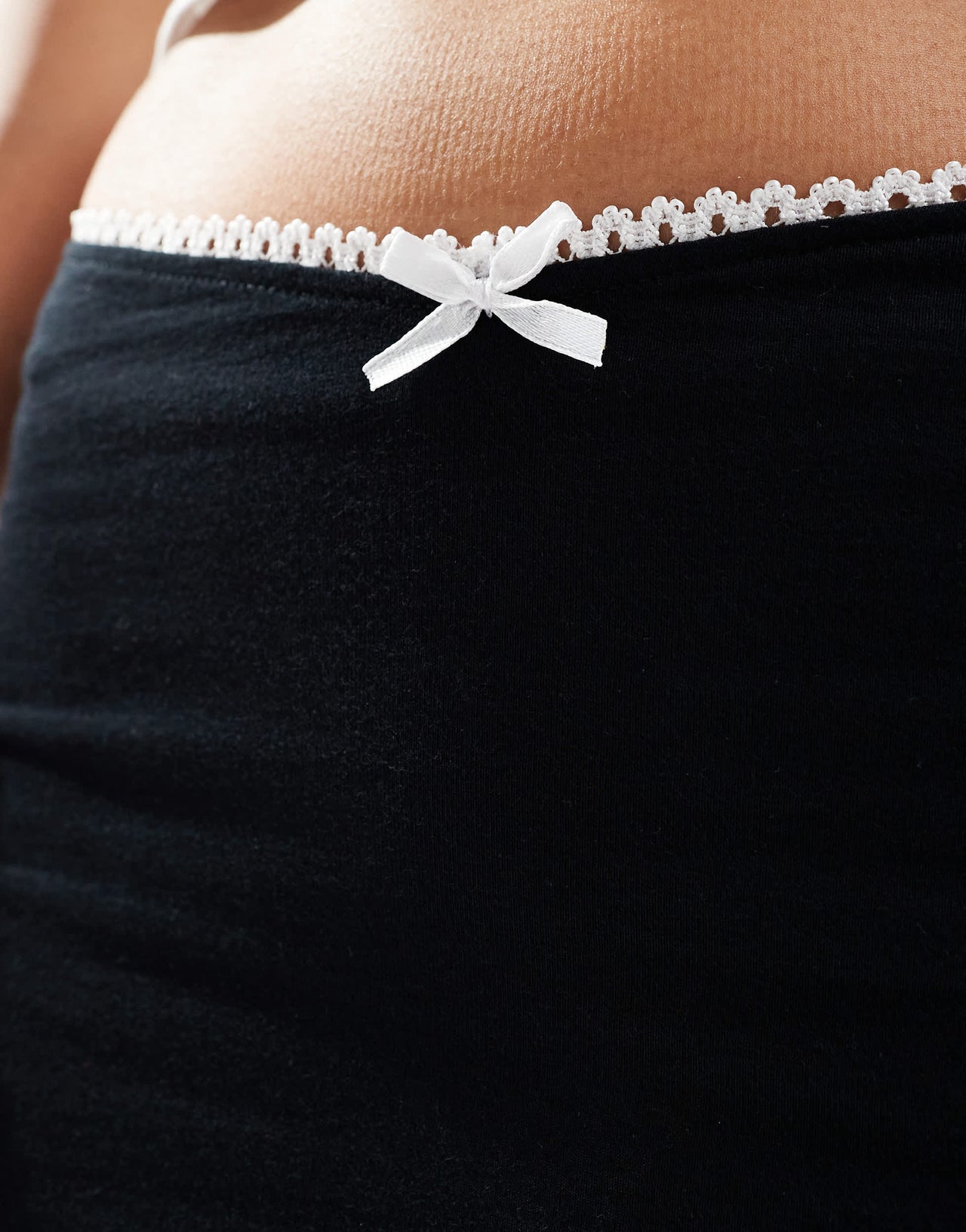 Motel vadia bow trim mini skirt in black