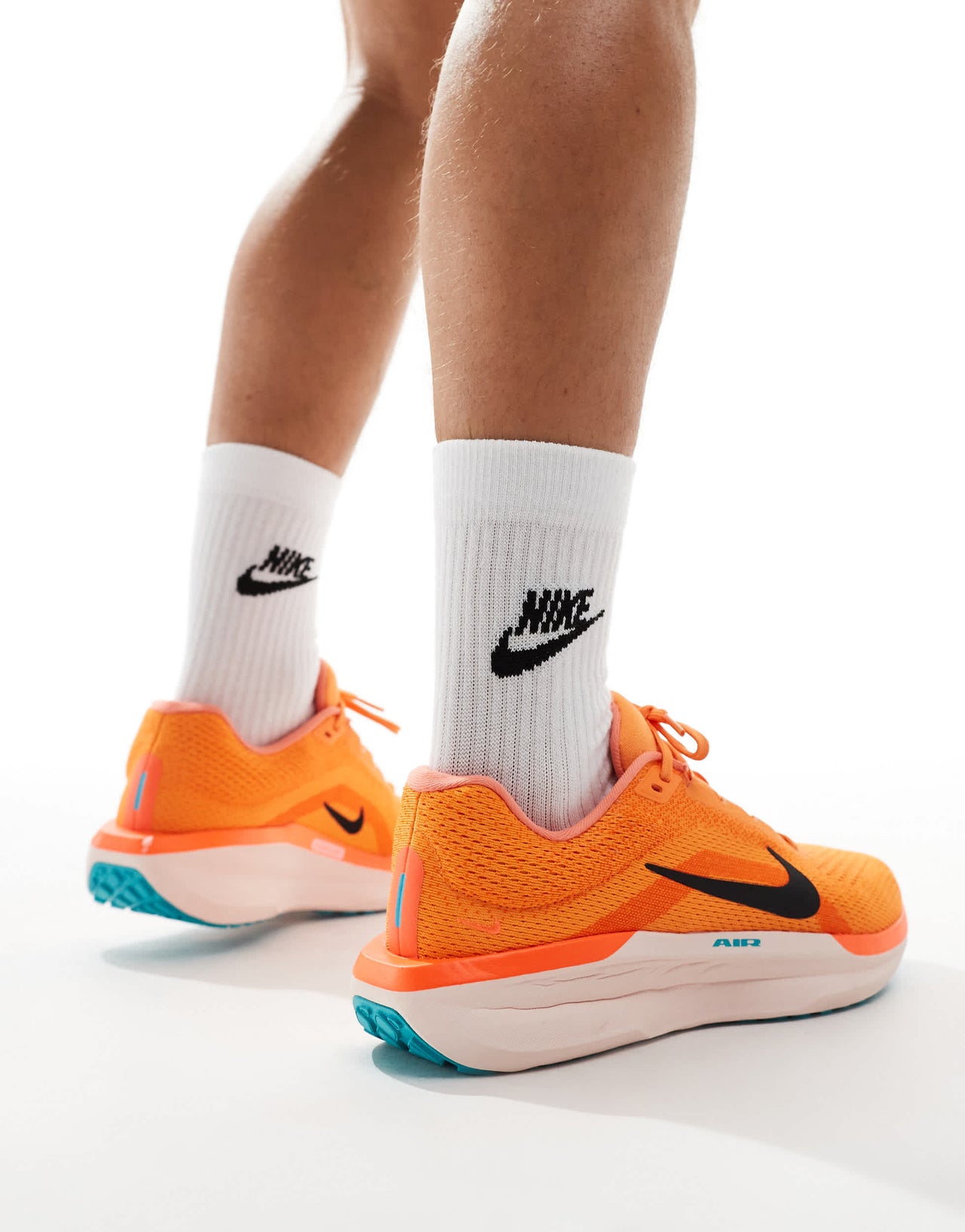 Nike Running Air Winflo 11 trainers in orange