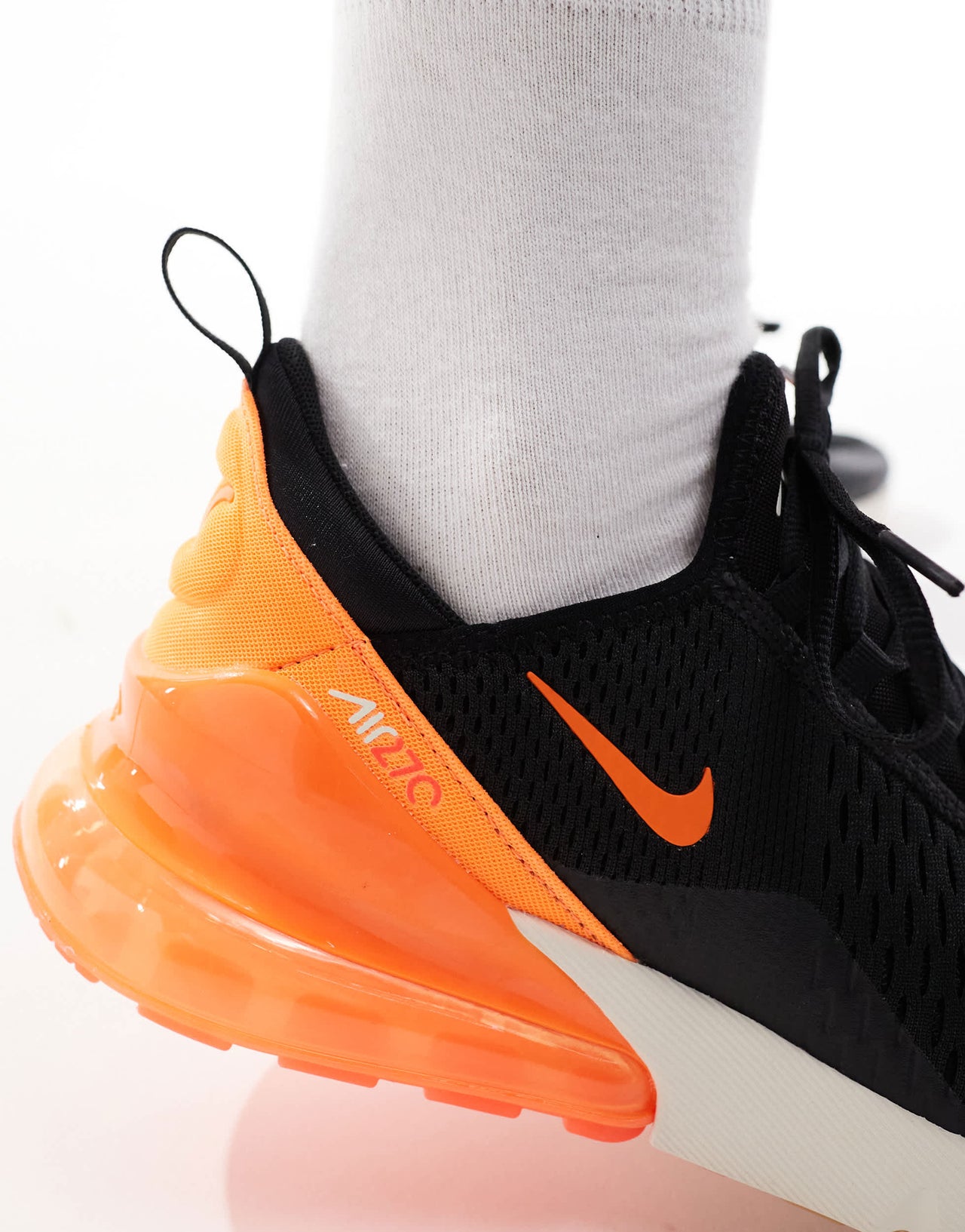 Nike Air Max 270 trainers in black, orange and white